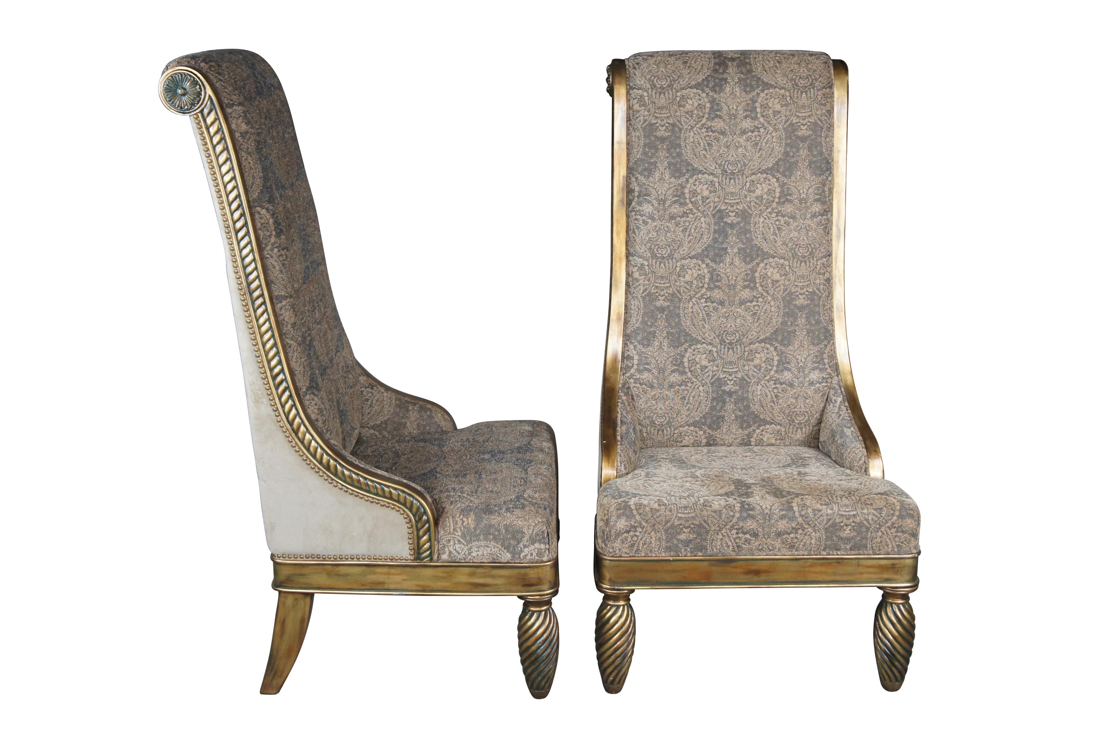 Pair of Hollywood Regency throne chairs featuring oversized gold frames with high rolled backs, accented with medallions and notched design, supported by twisted and flared legs, and upholstered with a velvet / suede nailhead