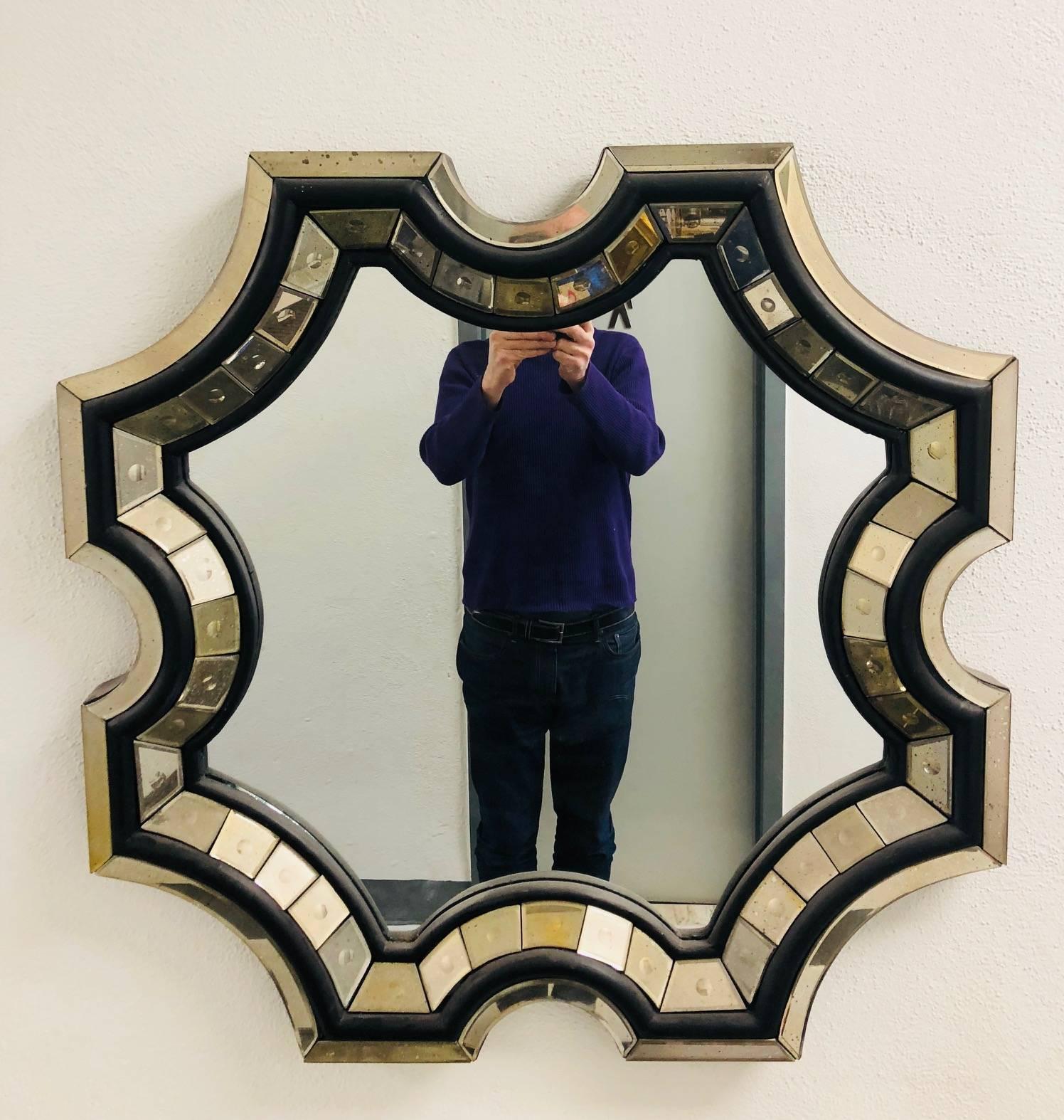 2 Elegant, Hand-made, French octagonal shaped / sunburst wall mirrors with modern and Neo-Baroque influences and in the style of Serge Roche. The mirrors have  a rare form and are artisan made using hand cut mirrored glass that is delicately angled 