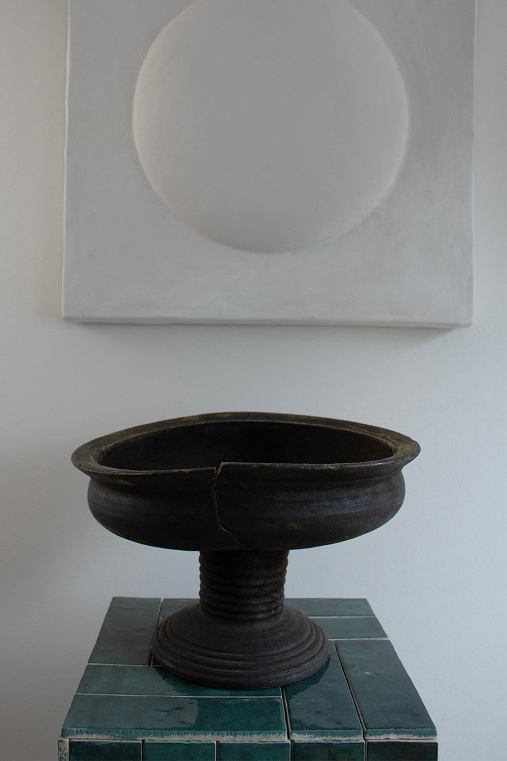 On offer are two French provincial wooden-footed bowls. 
Their imperfect and rough appearance is typical of objects found in the south of France. These bowls can be used to display fruit or as a centerpiece in the middle of a table. 

The bowls are