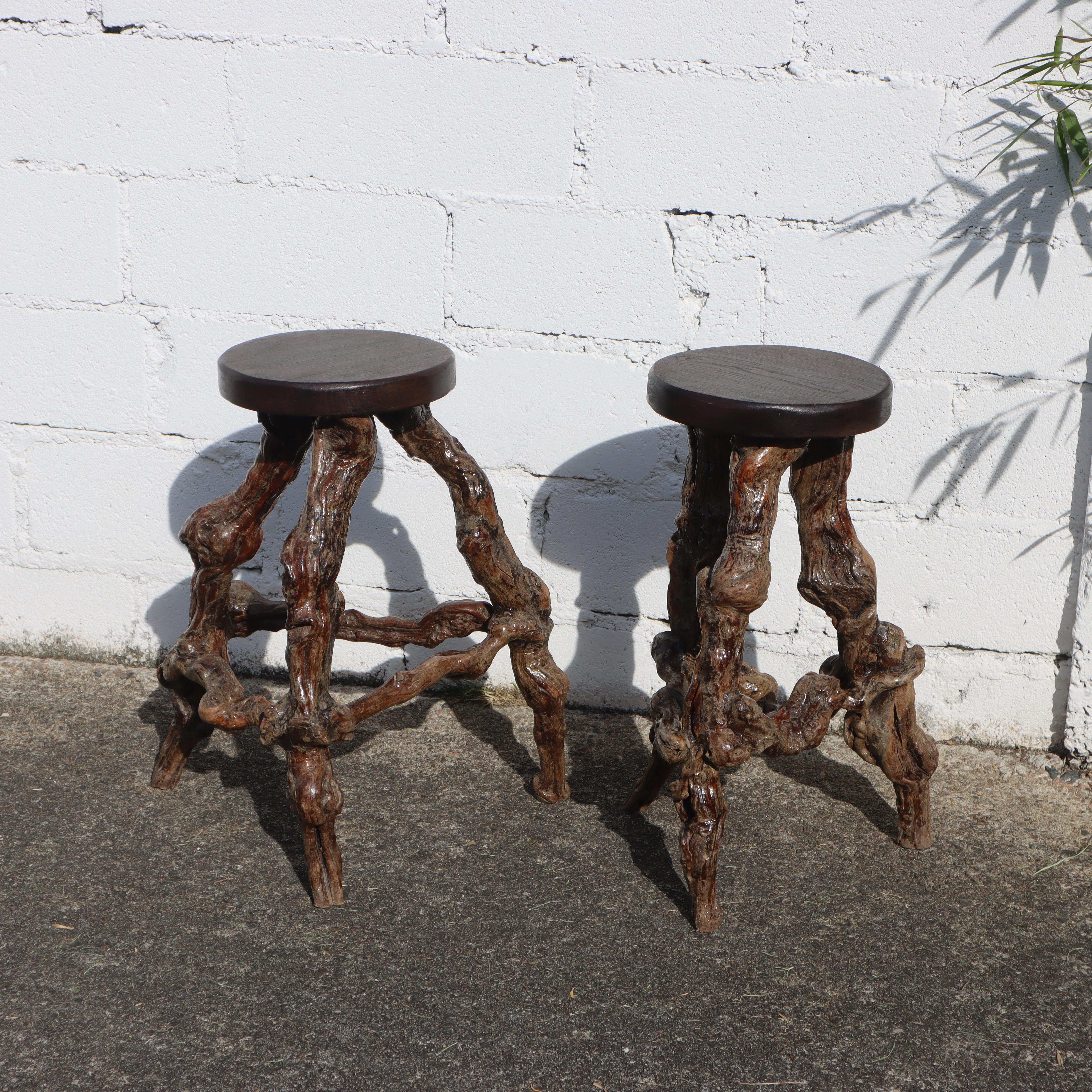 Two unique French vintage Bar Stools from the 1950s ,
crafted from thick Grapevine Branches. 
The Base, formed from naturally twisted Vine Roots, 
ensures each piece is distinctive, 
providing a solid and balanced Structure in a Rustic Style,