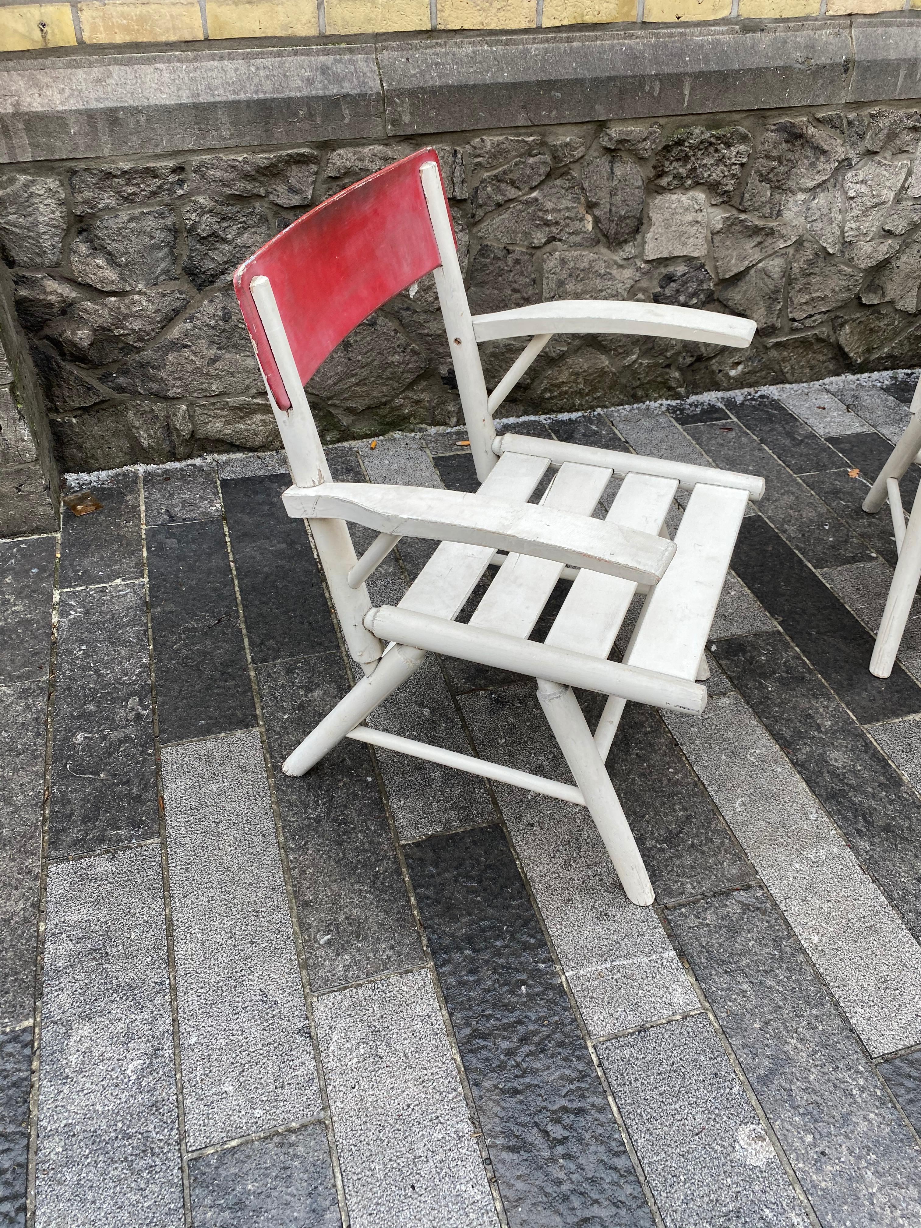 2 garden or veranda armchairs in lacquered wood, circa 1950-1960.