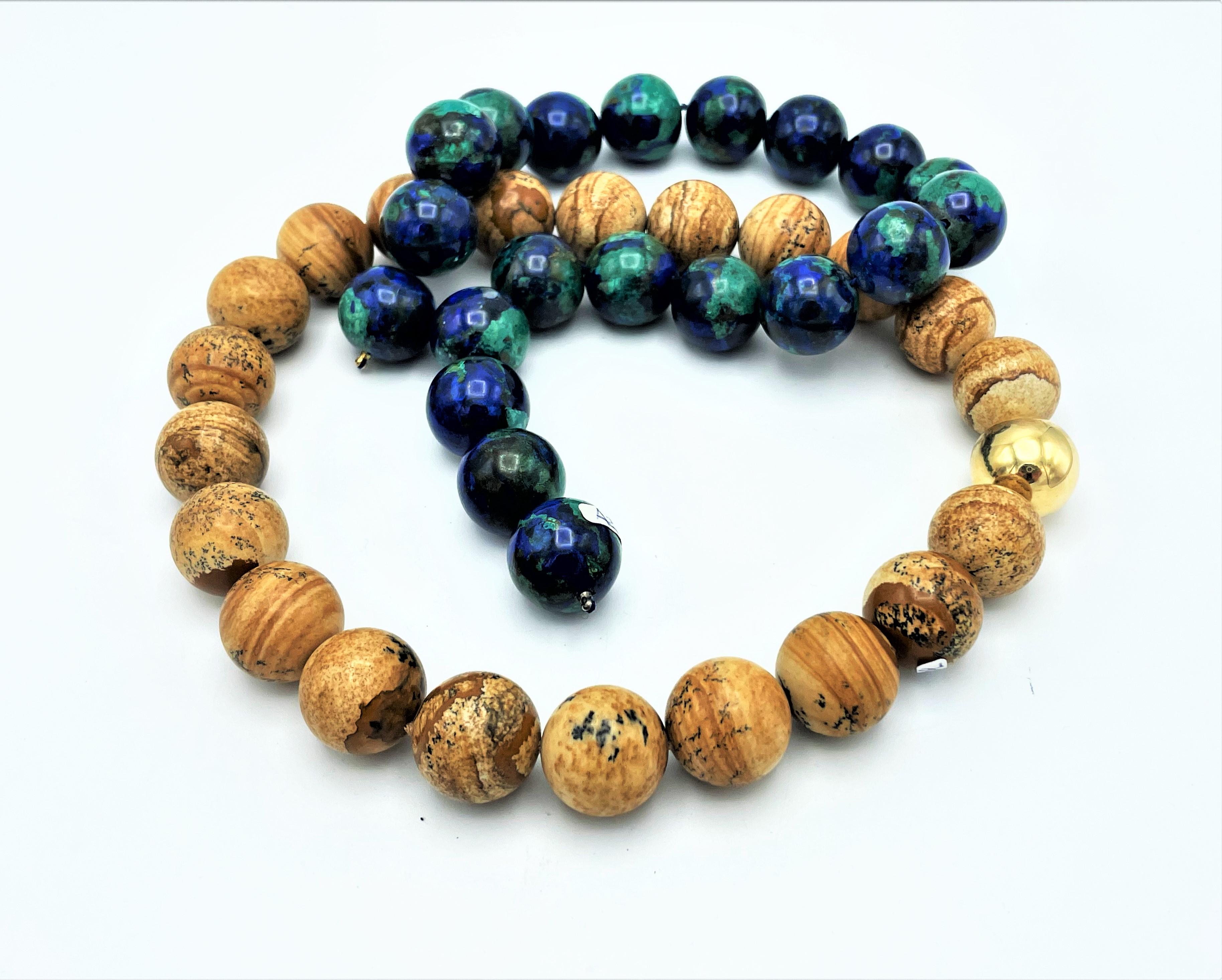 About
Both gemstone ball chains Azurite-Malacite and landscape Jaspis can be worn with an interchangeable gold-plated ball as a clasp.
Measurement: 
Azurit-Malachit length 15,5 inches ( 40 cm) 20 balls, diameter 0,8 inches (2 cm) - Length with clasp