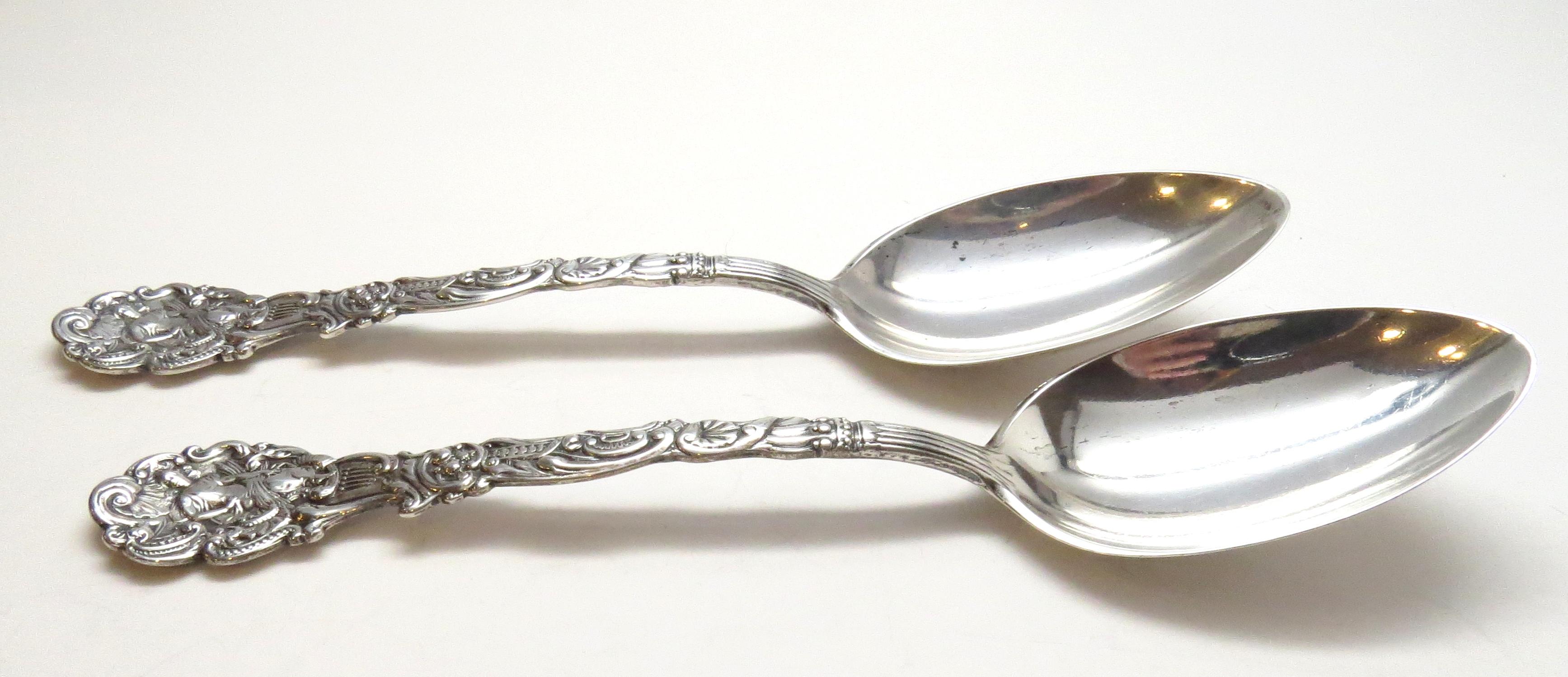 2 Gorham sterling silver table serving spoons in the Versailles pattern.
Marked: lion anchor G, STERLING COPYRIGHTED.
Monogram appears to be MG. Measures 8 1/2