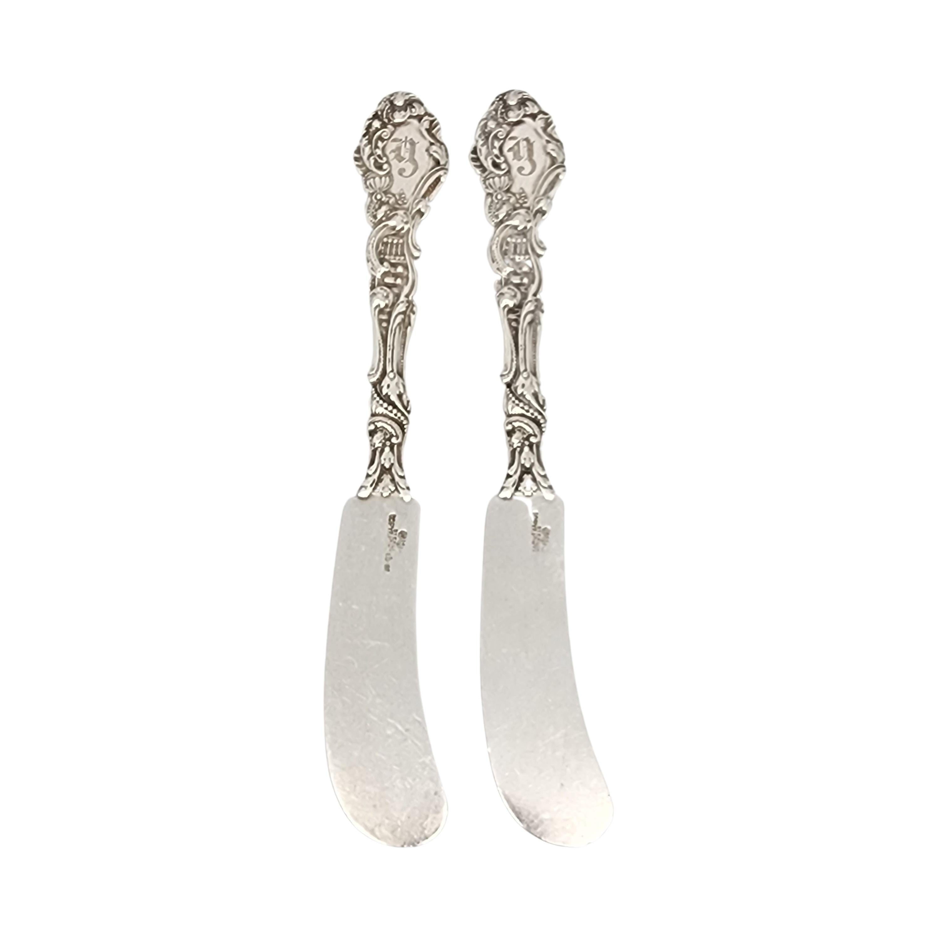 Set of 2 sterling silver large flat handle butter spreaders in the Versailles pattern by Gorham.

Monogram appears to be Y (see photo).

Gorham's Versailles is a multi motif pattern designed by Antoine Heller in 1885. Named for the Palace of