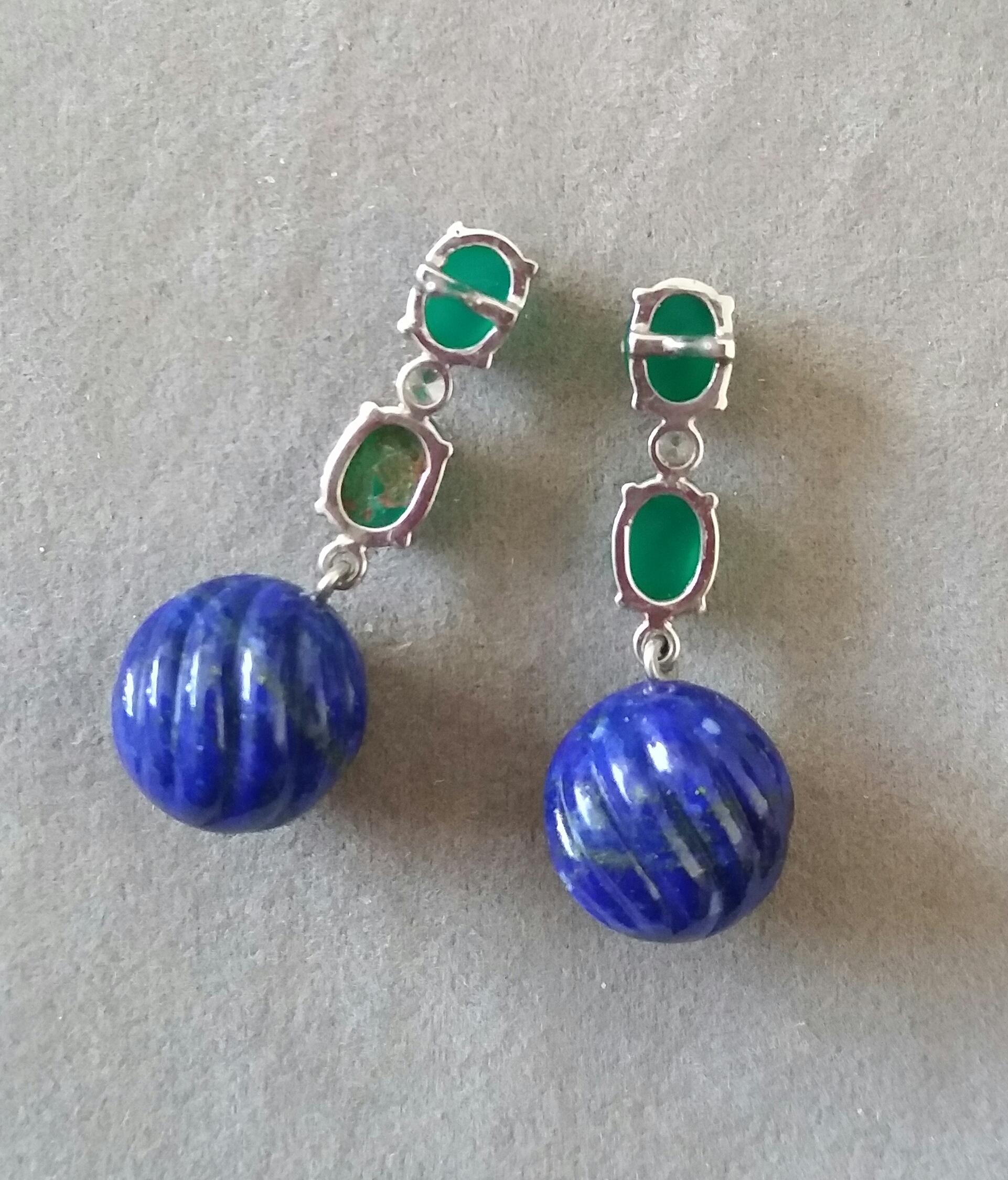 Elegant and completely handmade Earrings consisting of an upper part of 2 oval shape Green Onyx cabs of 5 mm x 7 mm set together in 14 Kt white gold with a  small diamond in the middle, at the bottom 2 Natural Lapis Lazuli Carved Round Beads