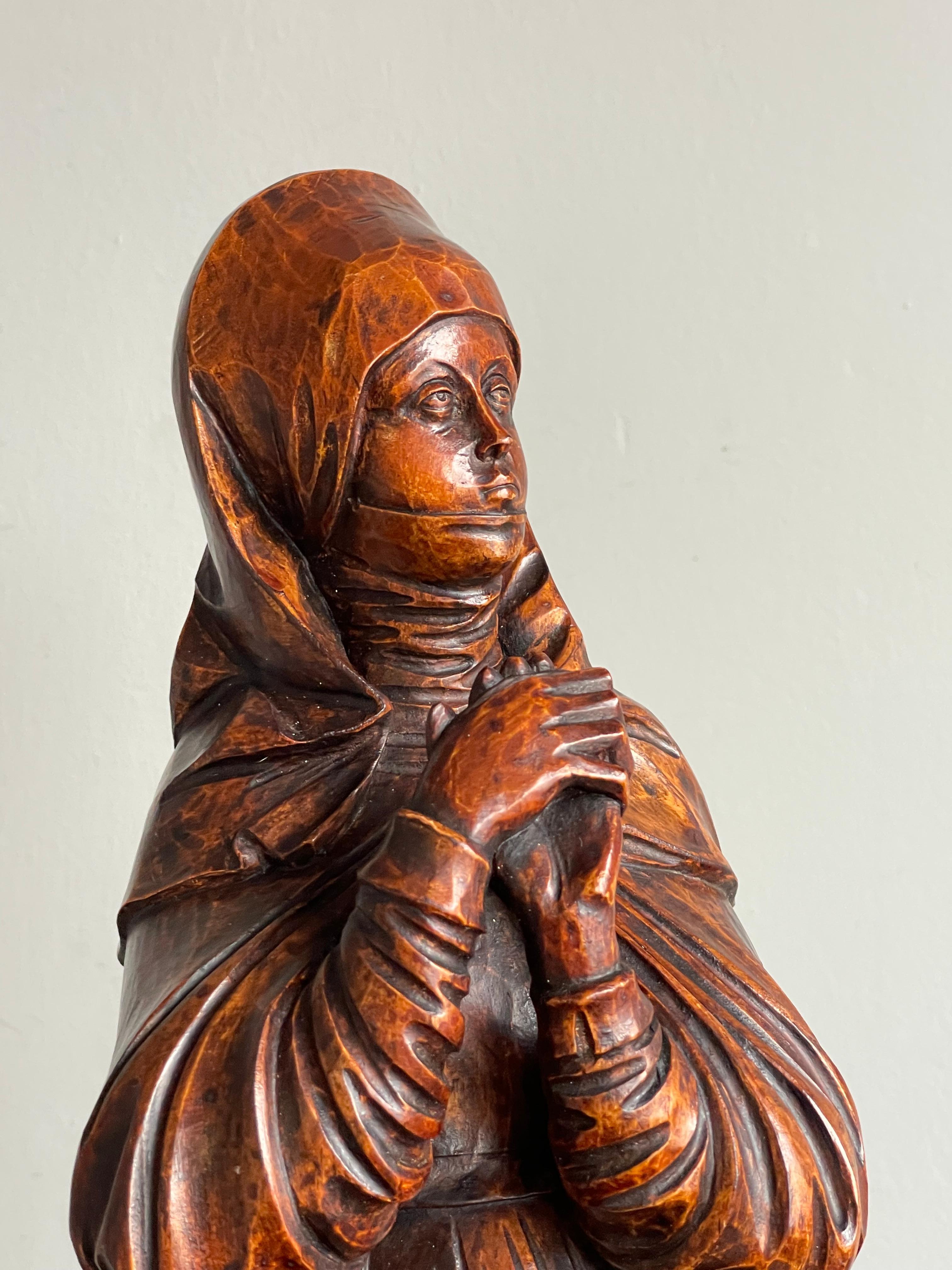 Rare pair of hand-carved works of devotional art with an amazing patina.

Saint Teresa of Ávila, born Teresa Sánchez de Cepeda y Ahumada, also called Saint Teresa of Jesus (1515-1582), was a Spanish noblewoman who chose a monastic life in the Roman