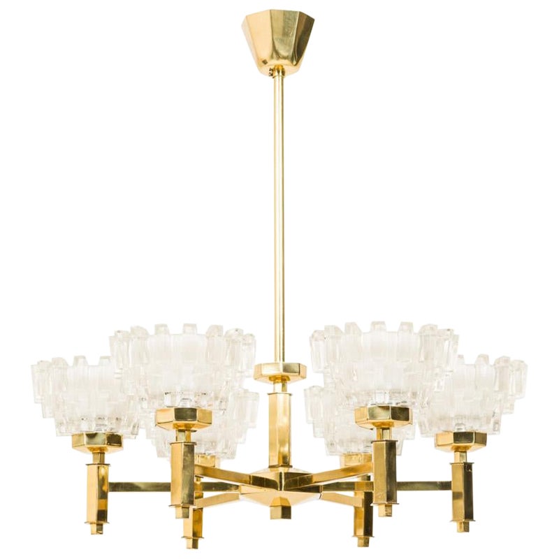 2 Hans-Agne Jakobsson MidCentury Brass 
Frosted Geometric Cut Glass Chandeliers For Sale