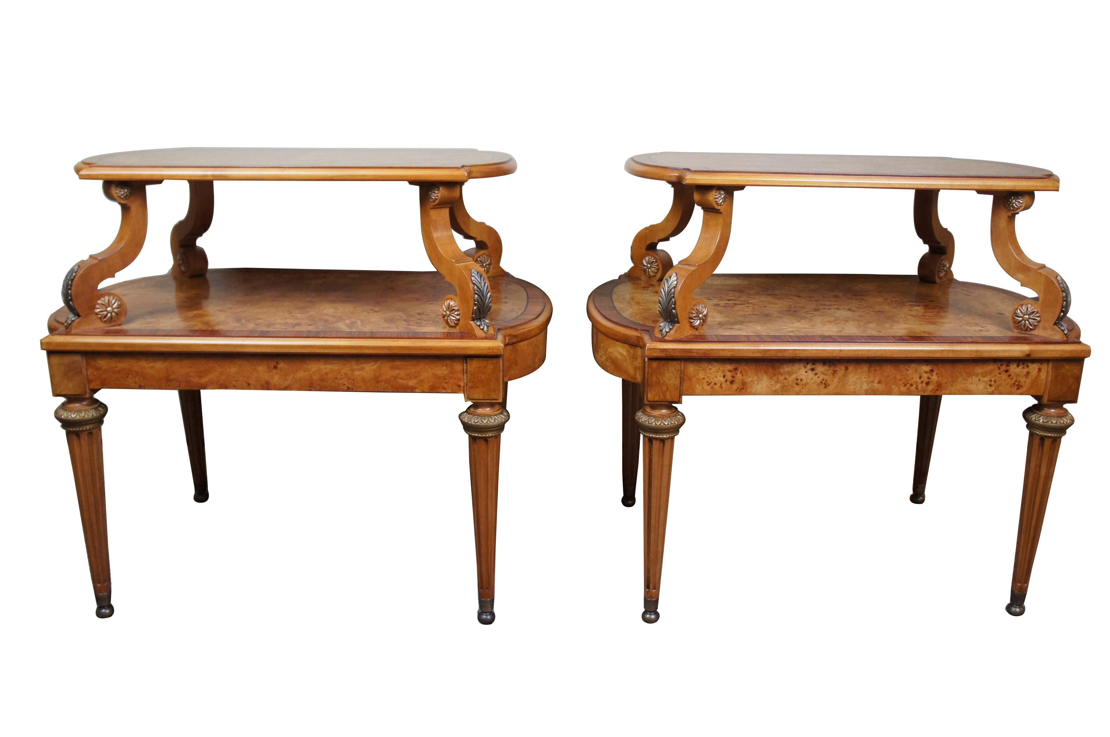 2 Henredon French Empire olive ashwood burled side tables 2-tier neoclassical

A beautiful pair of French Empire style olive ashwood burled end tables by Henredon. Exceptionally designed with 2 tiers, and scrolled supports. Features brass mounts