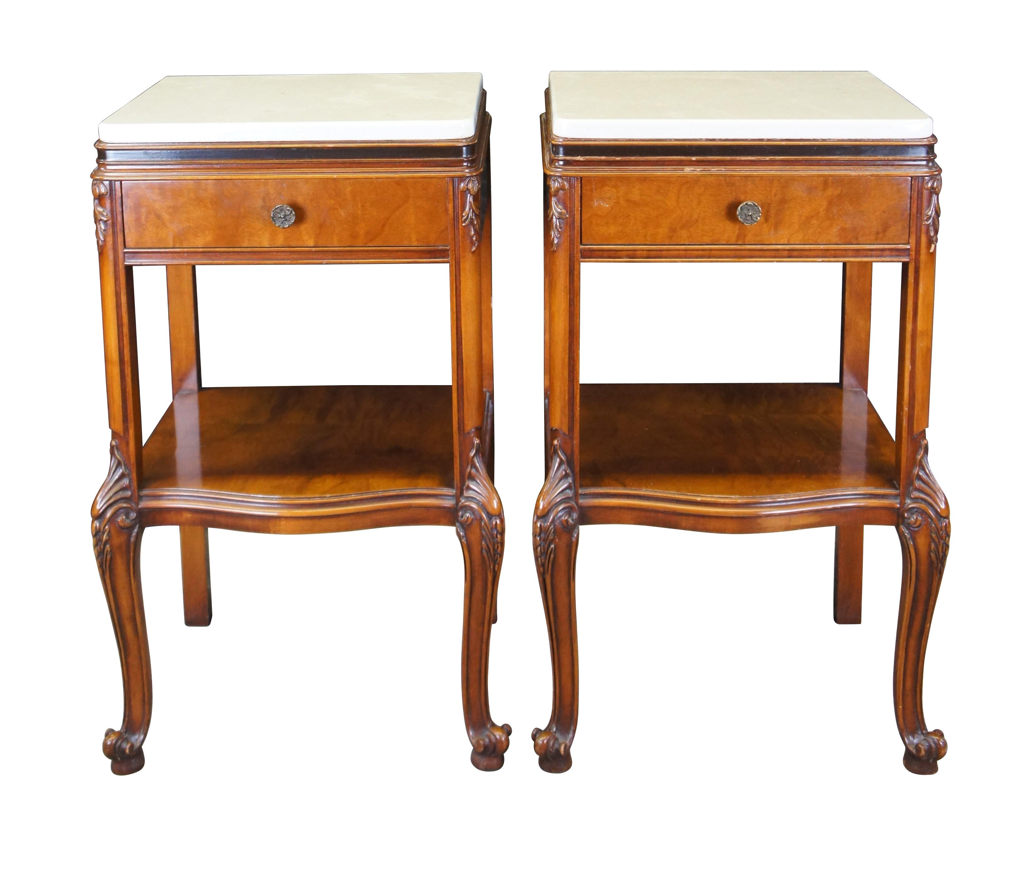 Pair of two Henredon French Provincial end tables, pedestals, nightstands.  Made of walnut featuring two tier design with marble tops and cabriole legs with acanthus design.  6065 430 

Dimensions:
18.5