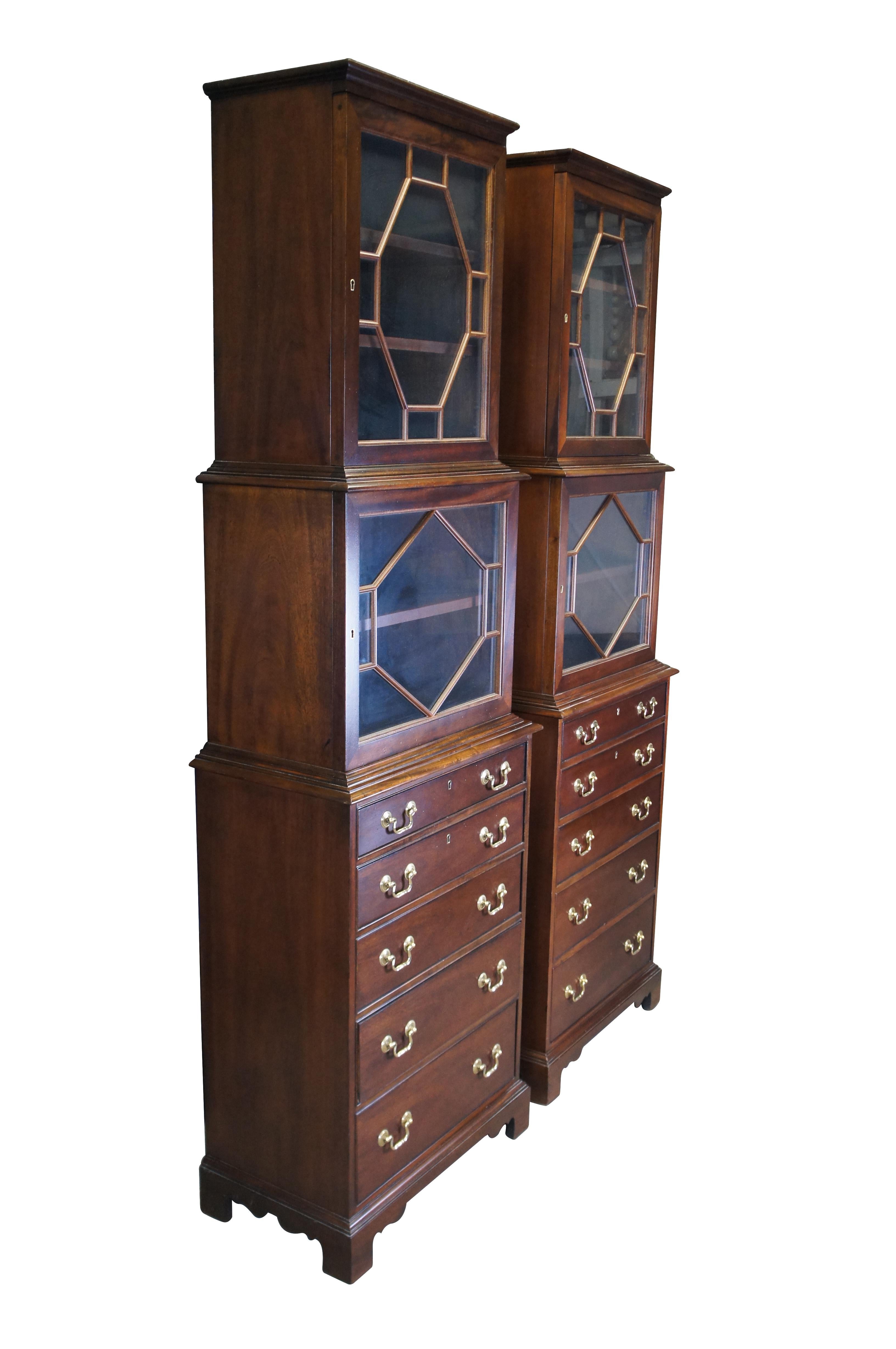Set of two vintage Hickory Chair Co English Georgian style Park Avenue tall flatware china / curio cabinets / bookcases / chests of drawers / bureaus.  Made of mahogany featuring two upper cabinets with fretwork doors and five lower storage
