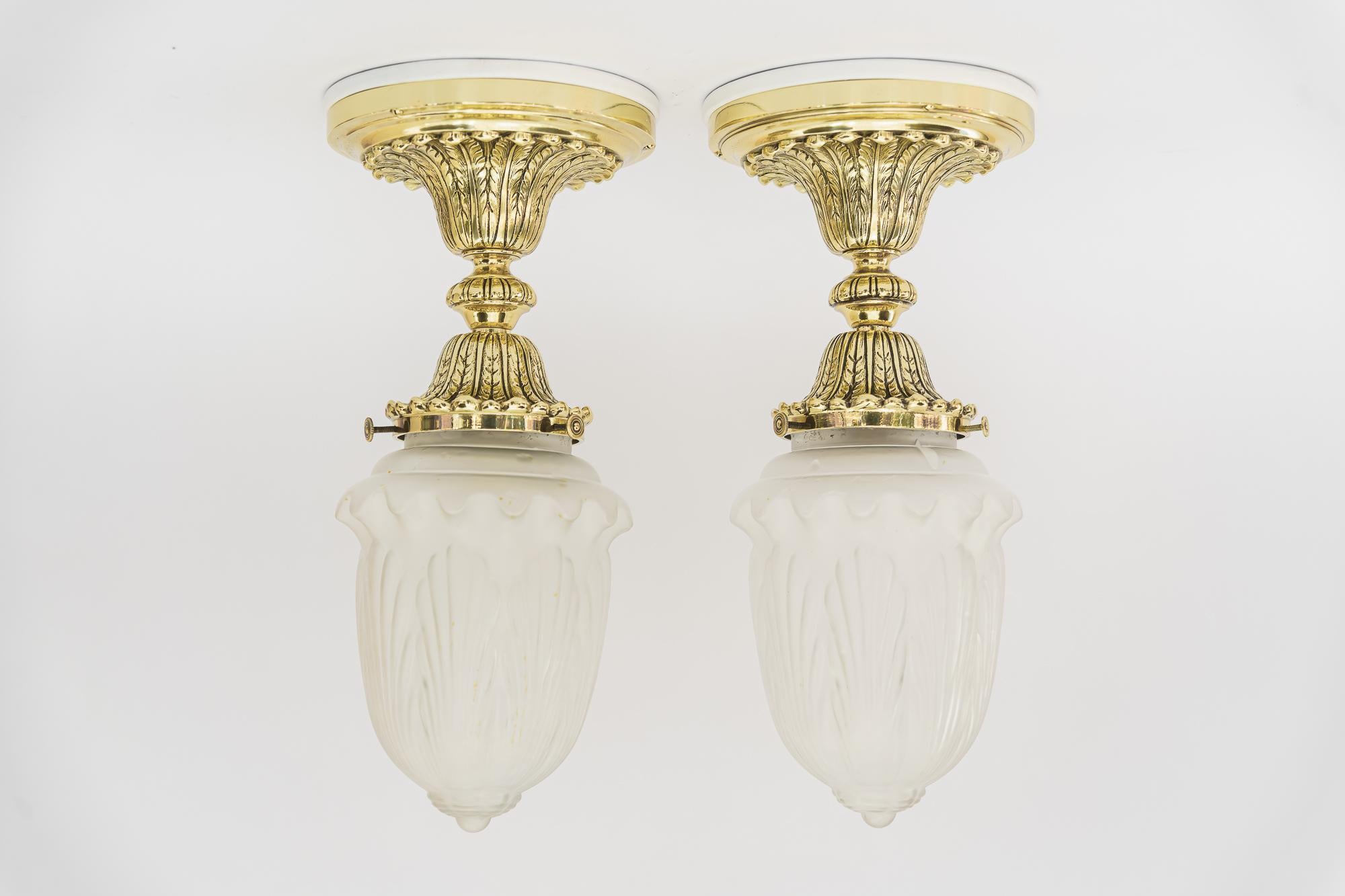 2 historistic ceiling lamps with original old glass shades vienna around 1890s
Polished and stove enameled
Wood plate white painted on top.