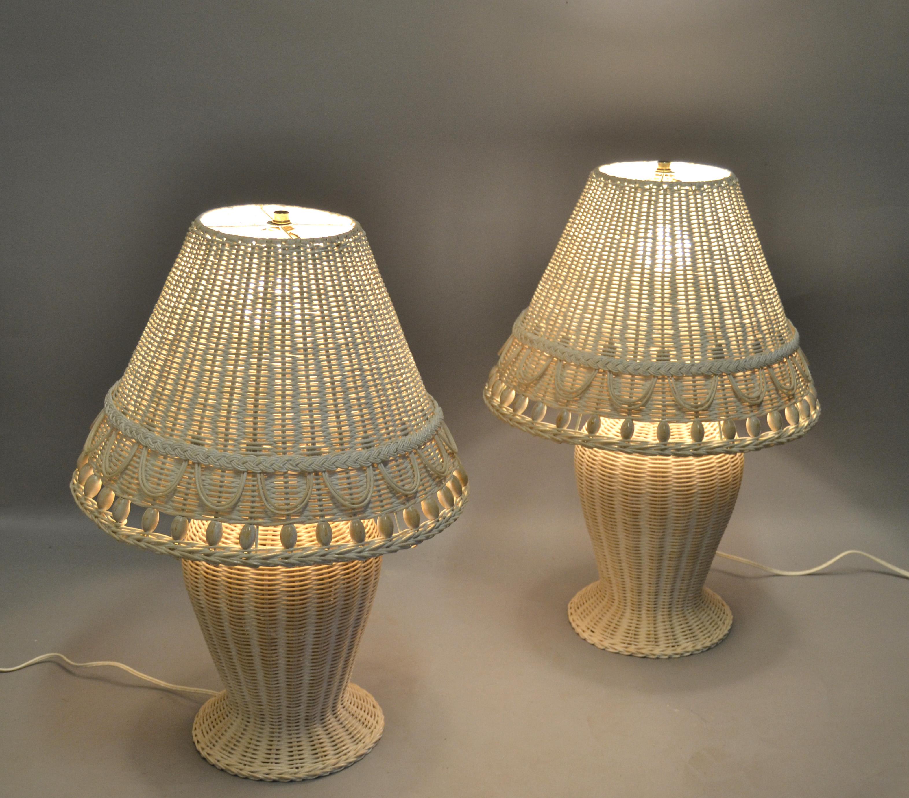 Pair of charming Bohemian Chic bleached white handwoven wicker table lamps with beaded shades.
Brass Hardware for secure daily use.
US Wiring and each Lamp takes 1 regular or LED Bulb.
All around handcrafted in America in the 1980s this Set adds