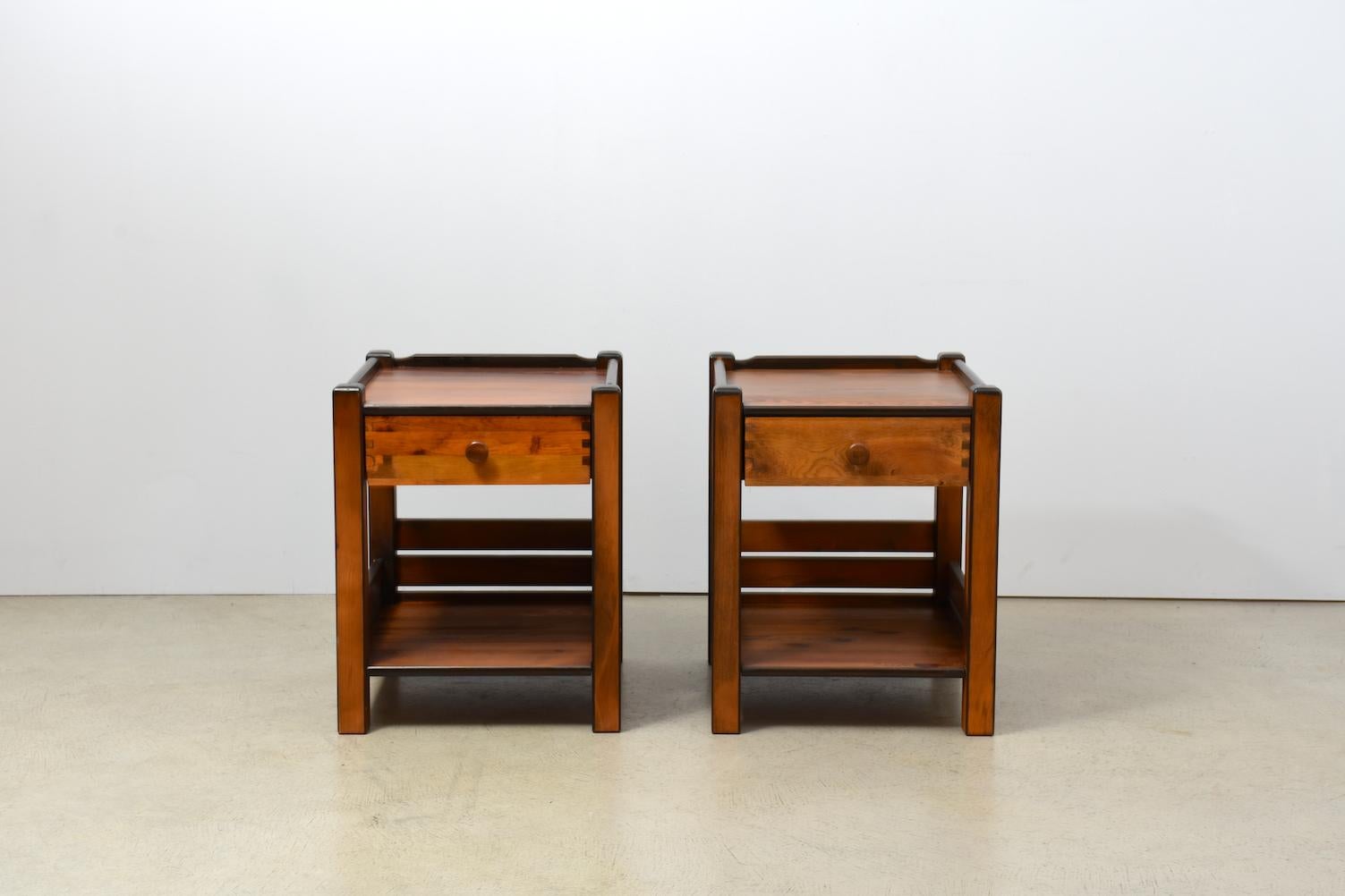 Pair of night stands with single drawer, stained pine wood. Produced in ex-Yugoslavia, 1970s. On the reverse with brand stamp.