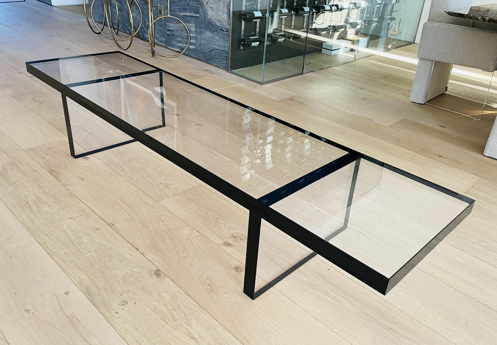 Introducing the Lucite Coffee Table / Bench in Clear & Black Lucite by Amparo Calderon Tapia! This stunning piece of furniture is a perfect blend of practicality and sophistication. Crafted from premium quality clear and black Lucite, this coffee