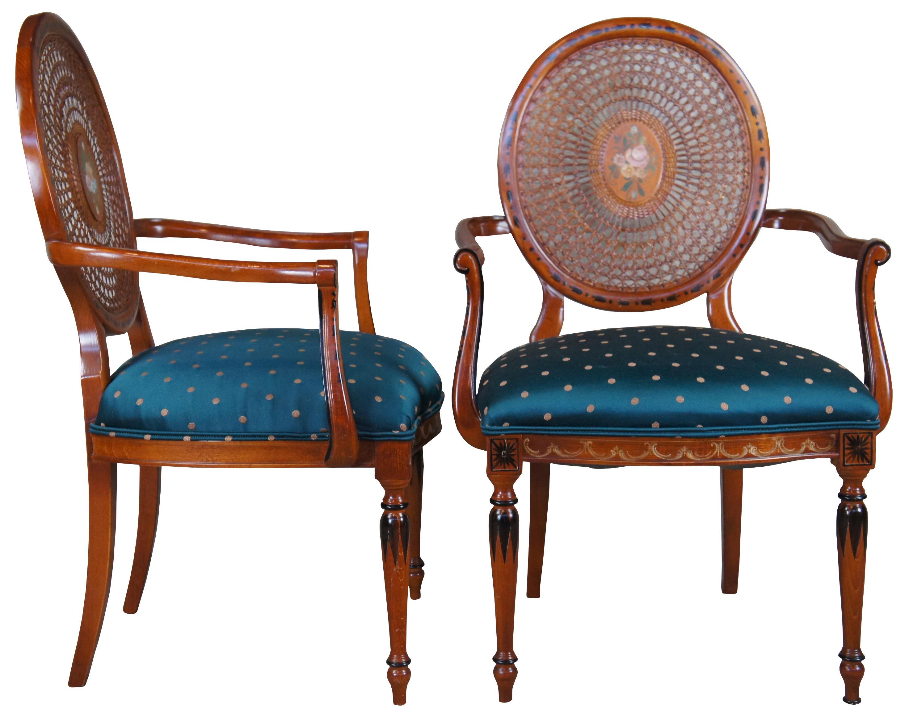 Vintage pair of two Pulaski Furntiure arm chairs. Featuring Louis XVI styling with caned wheel back, flared arms and hand painted details. Made in Italy.
     