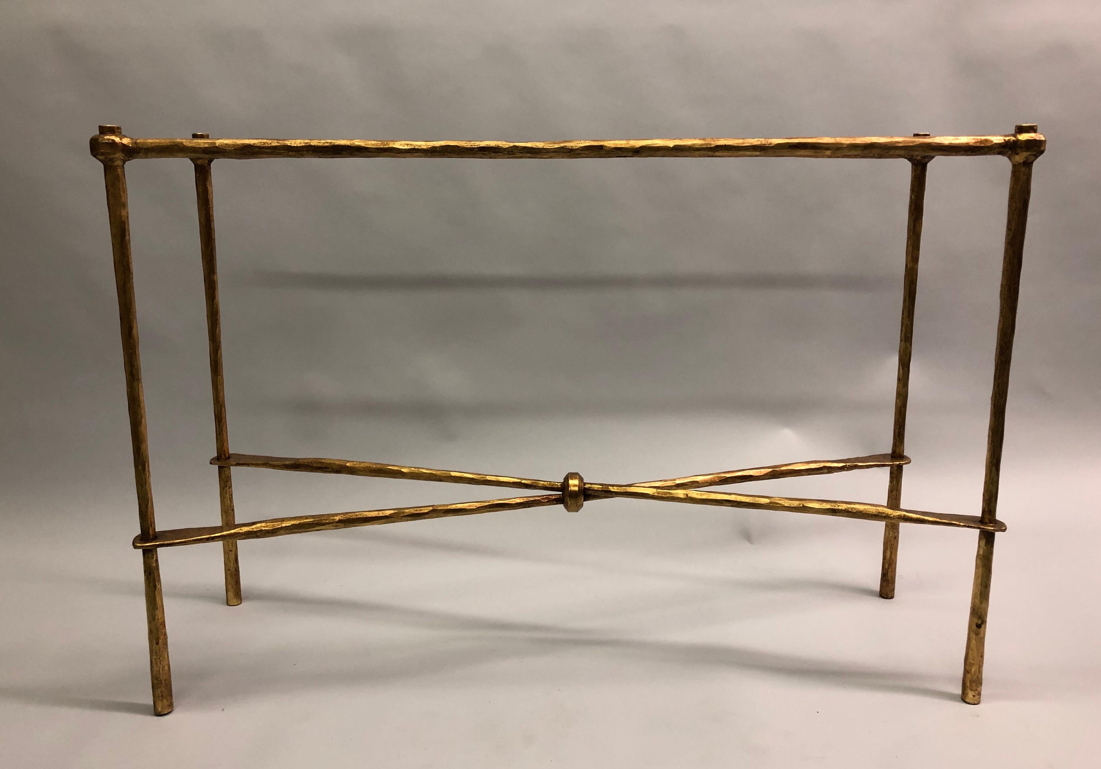 2 Italian Mid-Century Modern neoclassical hand hammered iron and gilt consoles / sofa tables by Giovanni Banci for Hermes. The consoles feature a stunning X-frame design cross-stretcher which pass through an open hammered iron ring, Deep individual