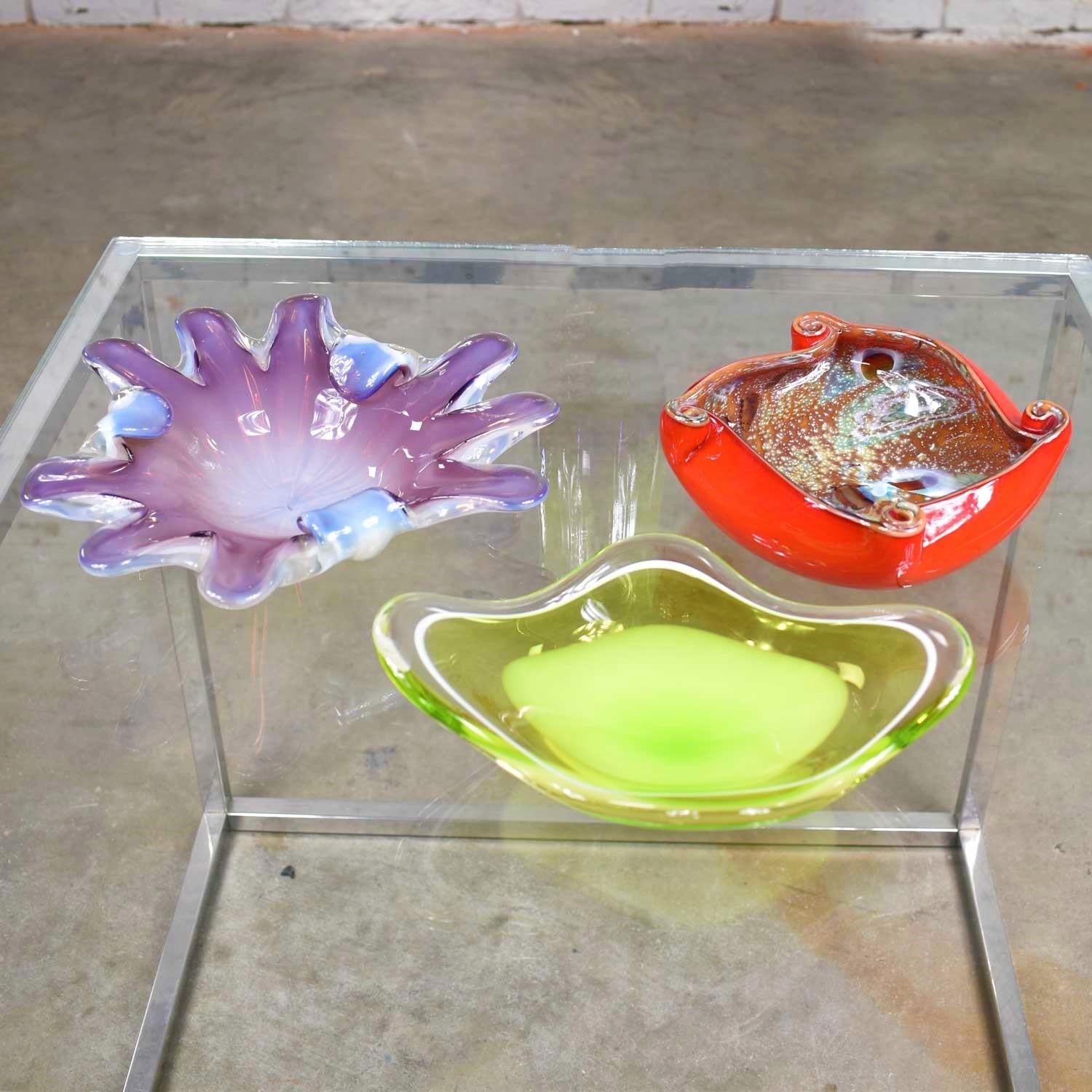 Three gorgeous pieces of art glass; two Italian Murano glass dishes attributed to Fratelli and Toso and one signed Scandinavian bowl by Kedelv for Flygsfors. We are selling these individually so you can choose one, two, or three. They are all in