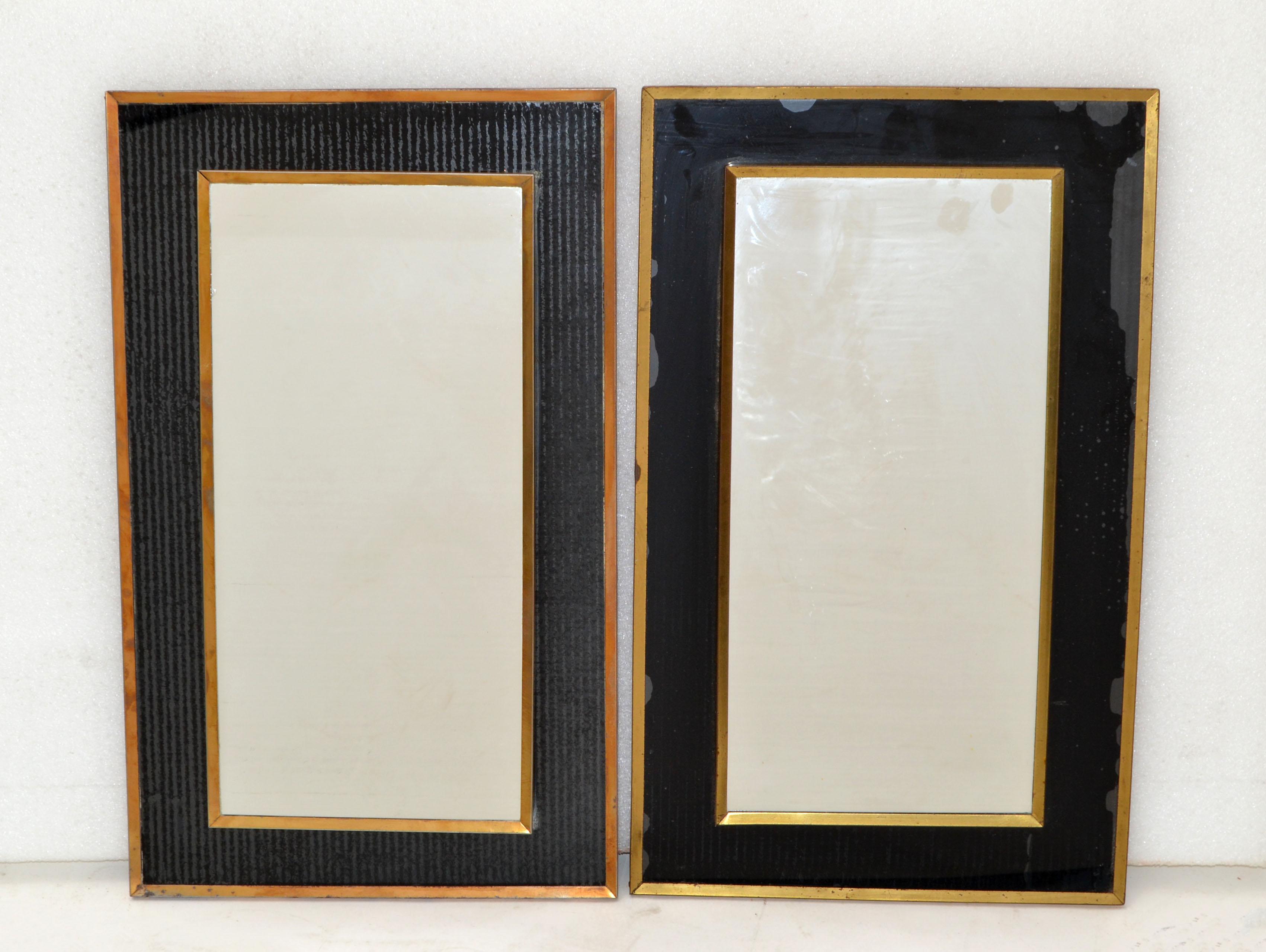 Pair of small mirror in the style of Jacques Adnet, brass finished and black opaline frame.
Mirror measures: 19.5 inches height x 9.5 inches width.
Can be hung horizontal or vertical.