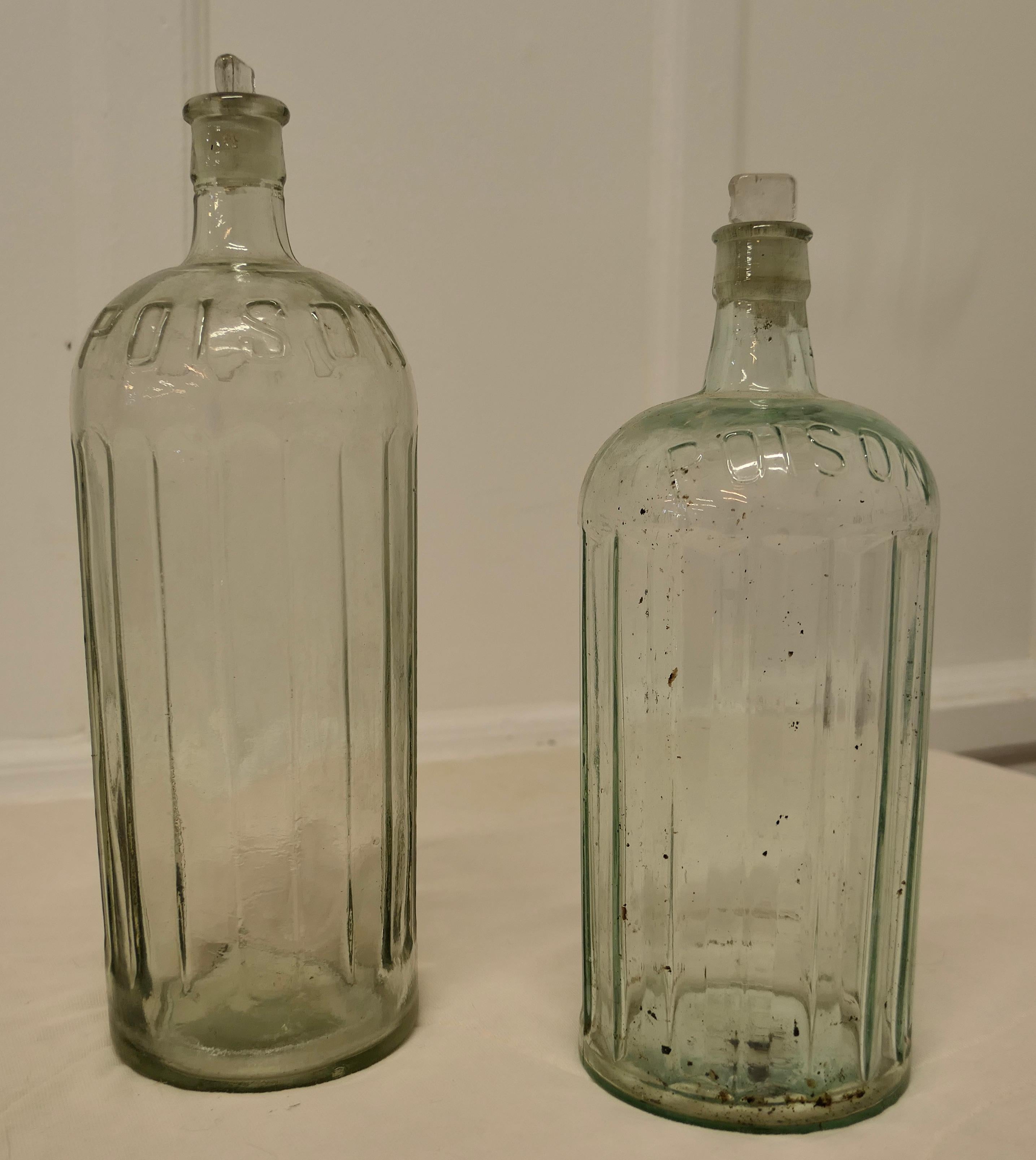 2 Large 19th Century Clear Glass Pharmacy Poison Bottles

These are 2 very large bottles, they are 6” in diameter and one is 14” high , the other is 13” high, and one has the no 80 underneath

These bottles are in their original undamaged