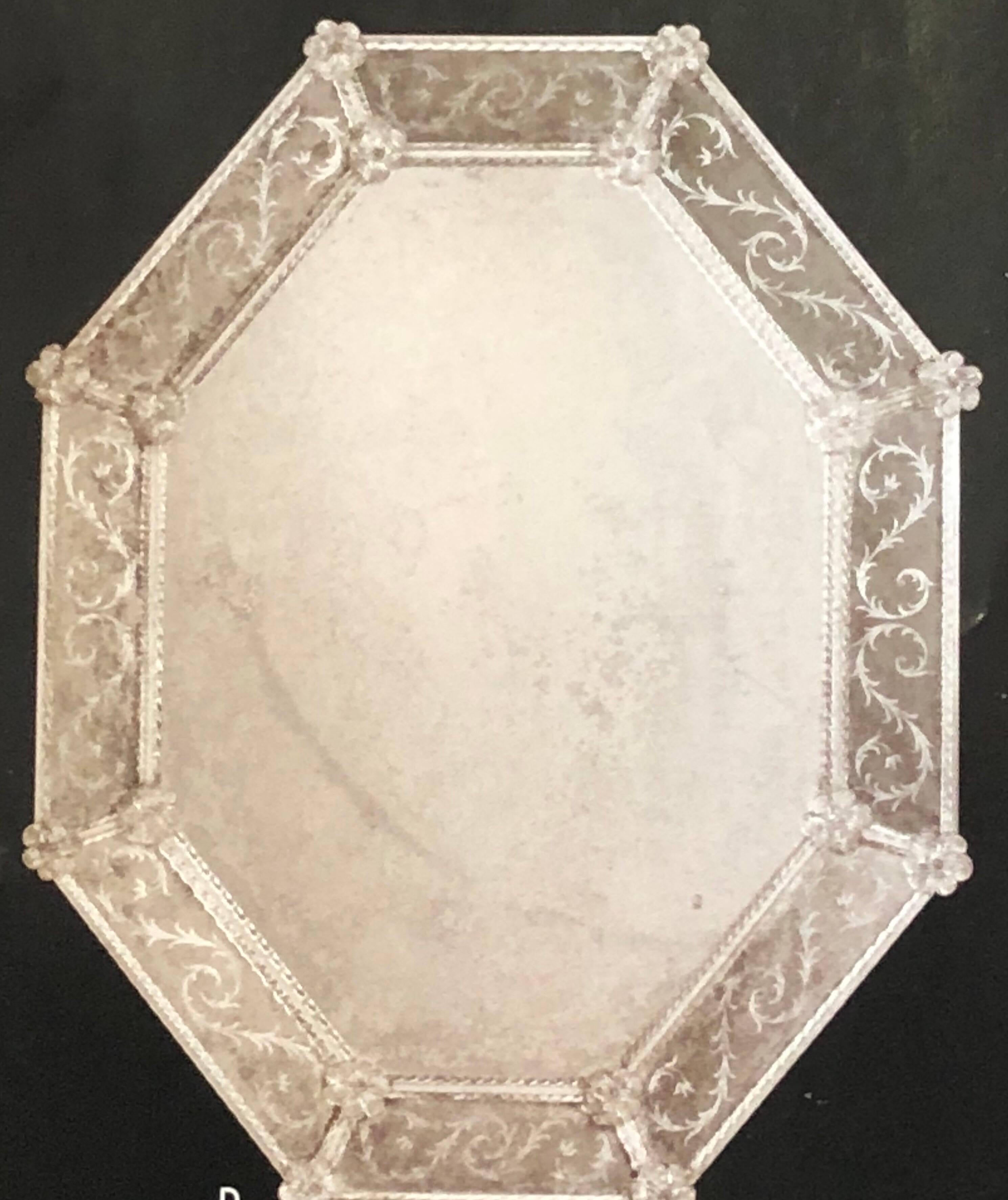 Two large Italian antiqued and etched Venetian / Murano glass octagonal wall mirrors

The pieces are delicately etched with sober, floral decoration and have clear glass braided and twisted Murano glass borders and clear Murano glass