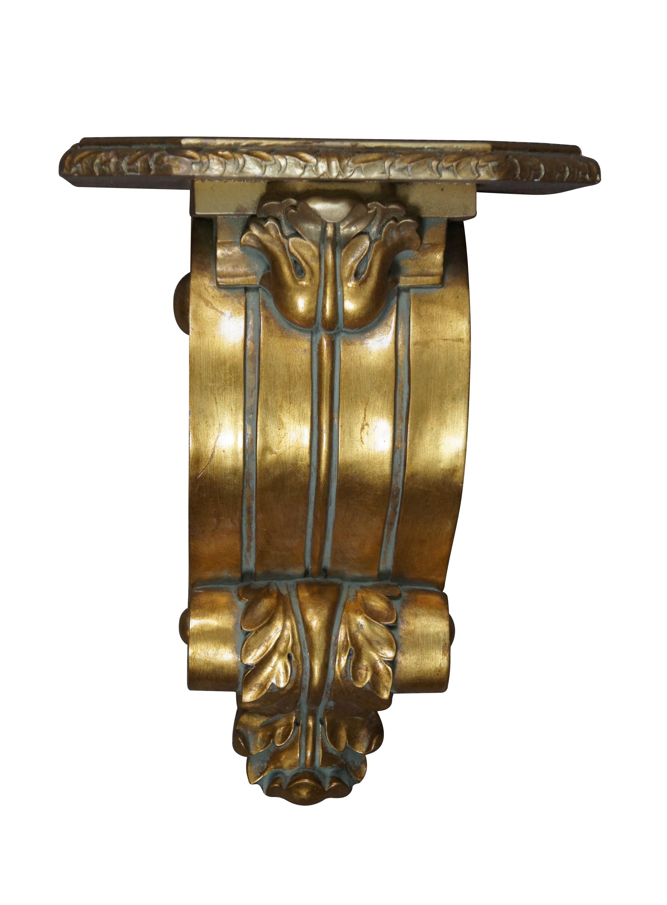 Pair of vintage 20th century giltwood corbels / wall brackets, featuring a grooved scrollwork body embellished with acanthus leaves. Rectangular top with clipped corners and foliate edge detail. WB-1016

Dimensions:
14.5