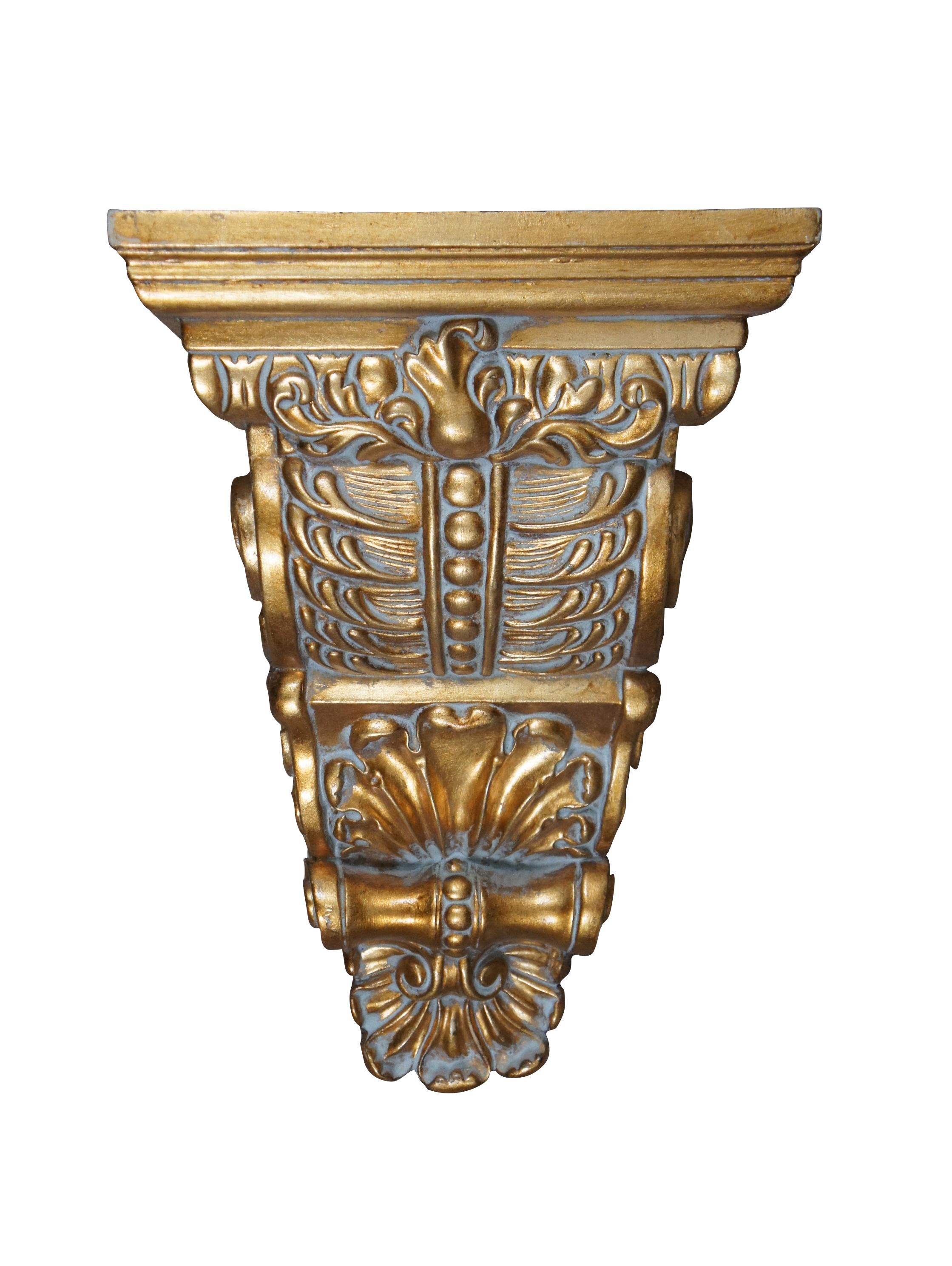 Pair of vintage 20th century gilt corbels / wall brackets / shelves with a French inspired design of scallops, foliates, and scrollwork. Rectangular top. Composite foam with inset picture hooks.

Dimensions:
11