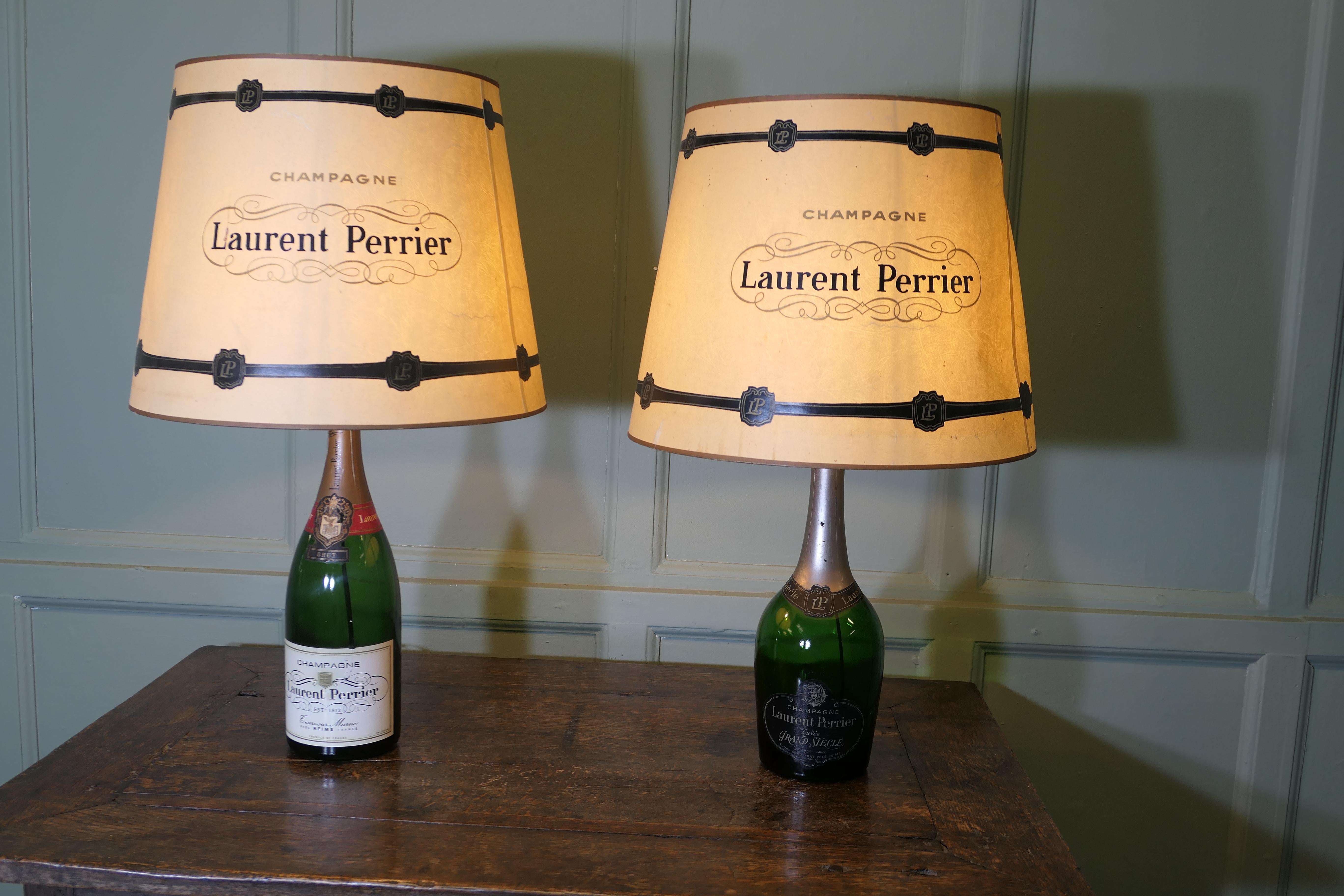2 Laurent Perrier Exhibition Advertising Table Lamps

2 Perrier Laurent Champagne Cuveé Advertising Table Lamps, fresh from France this superb duo was part of a  Chateau Exhibition display, they are genuine bottles and come with original matching