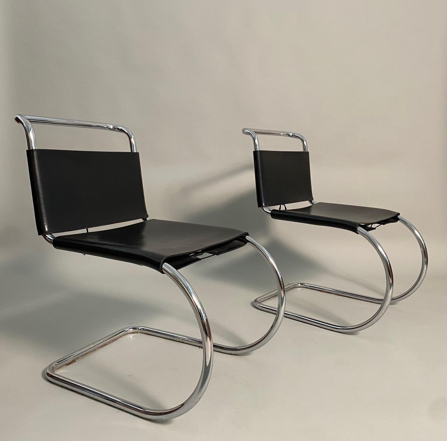 Vintage set of 2 MR10 dining chairs by Mies Van der Rohe. Chrome cantilevered frames with black original leather