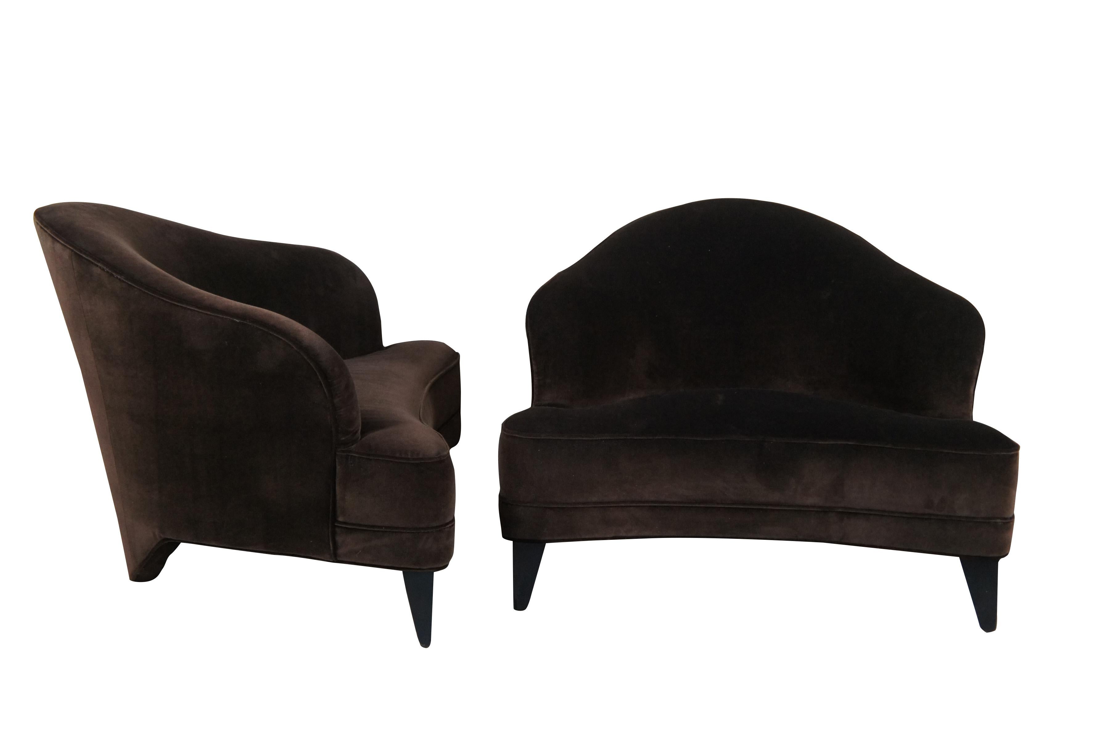 A pair of chocolate mohair chairs by Leon Rosen for Pace.  Features a unique triangular form with downswept arms and a plush seat.  Each chair is supported by black tapered feet.  The set was recently recovered in the brown mohair.

The Pace