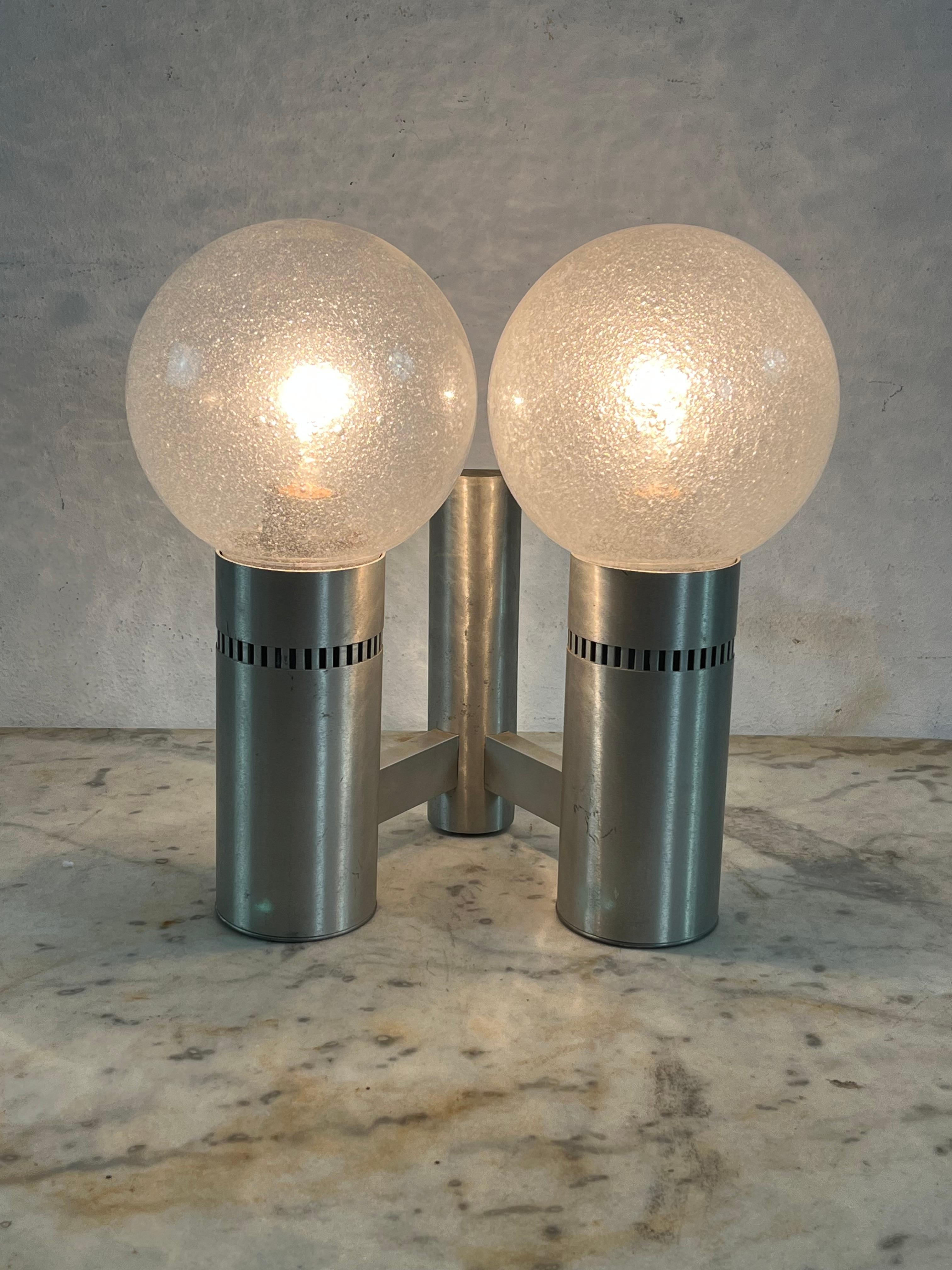 2-light brushed steel and glass wall lamp, Made in Italy 1970s
Intact and in good condition, E27 lamps