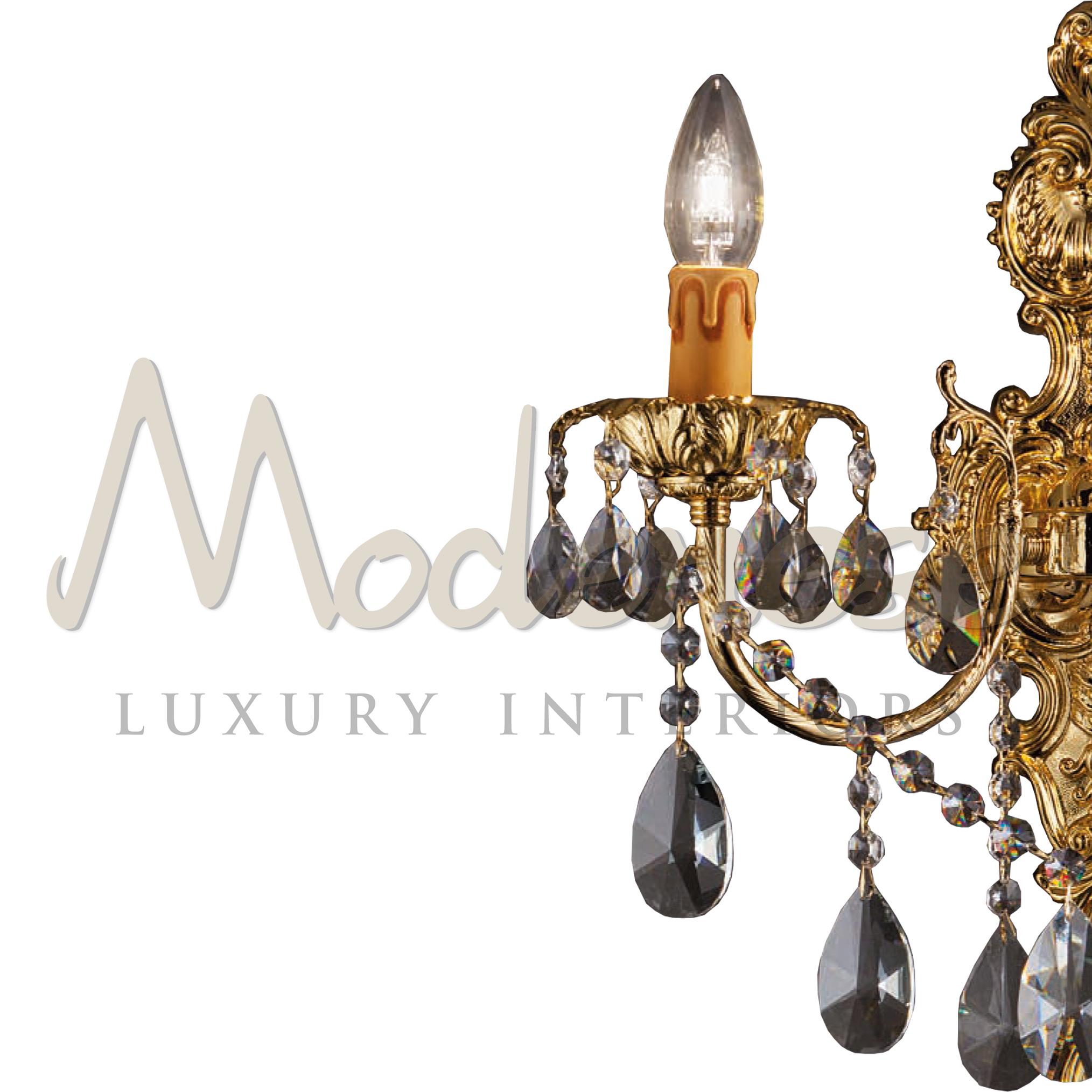 Elegant shiny artistic casting wall sconce by Modenese Gastone Luxury Interiors. Mainly used in bespoke residential projects, this scrupulously moulded wall sconce features a baroque two arms structure completed by a magnificent composition of