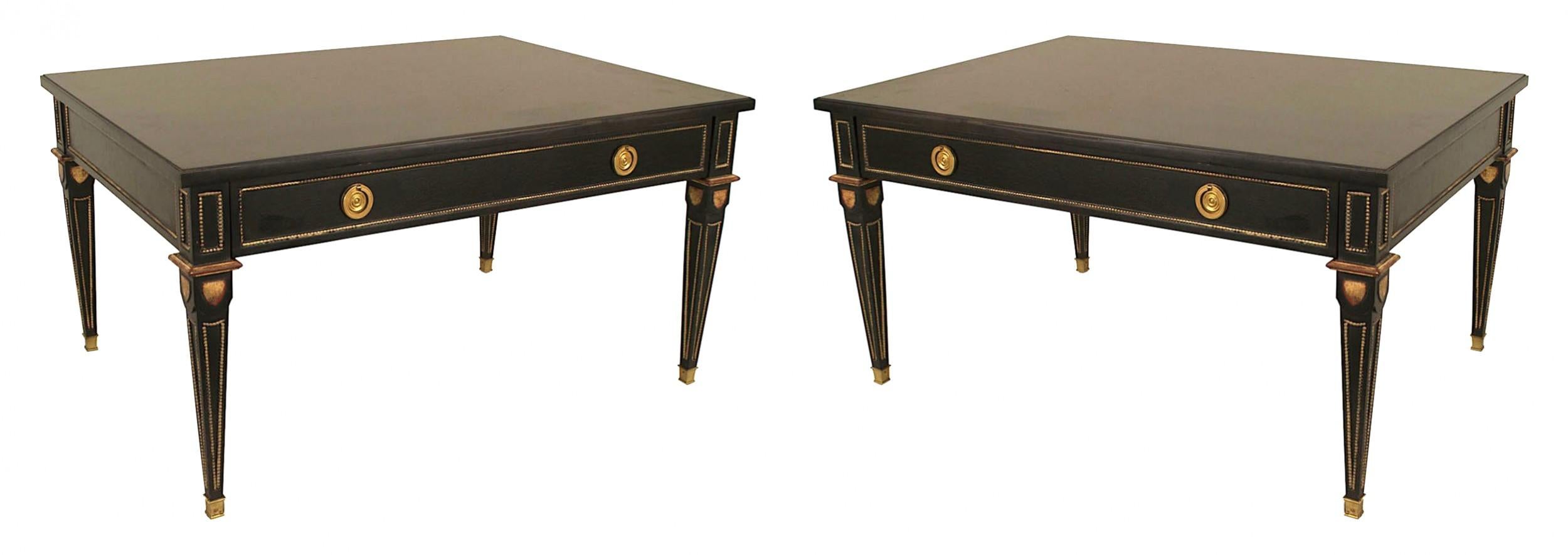 2 French Louis XVI-style (1940s) rectangular ebonized and gilt coffee tables with one drawer, bronze trim, and square tapered legs. (stamped: JANSEN) (PRICED EACH)
