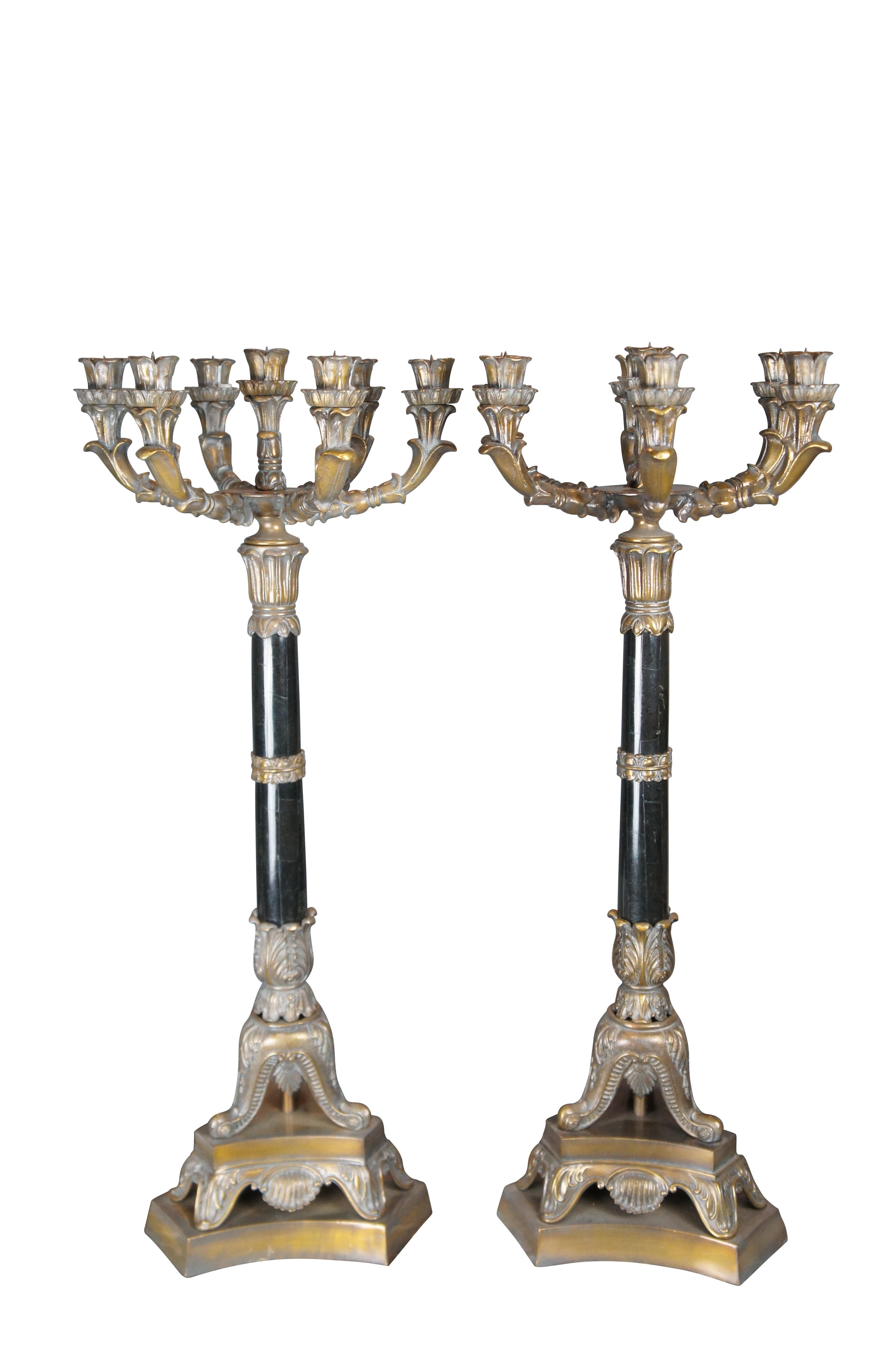 A large pair of Maitland Smith candlesticks, circa last quarter 20th century. Features French styling with exceptional craftmanship. Each candle holder is made from bronze with a seven light candelabra along the top over a central Grecian column