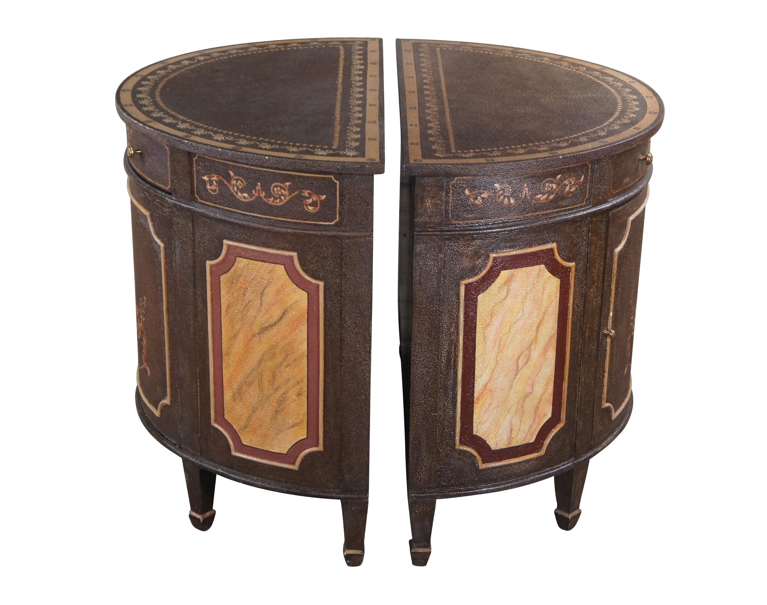 Pair of two Maitland Smith Poise Chiffonier sideboard cabinets, console tables or commodes featuring demilune / half round form with upper drawer, lower cabinet and textured hand painted finish of a Neoclassical urn with lion heads surrounded by