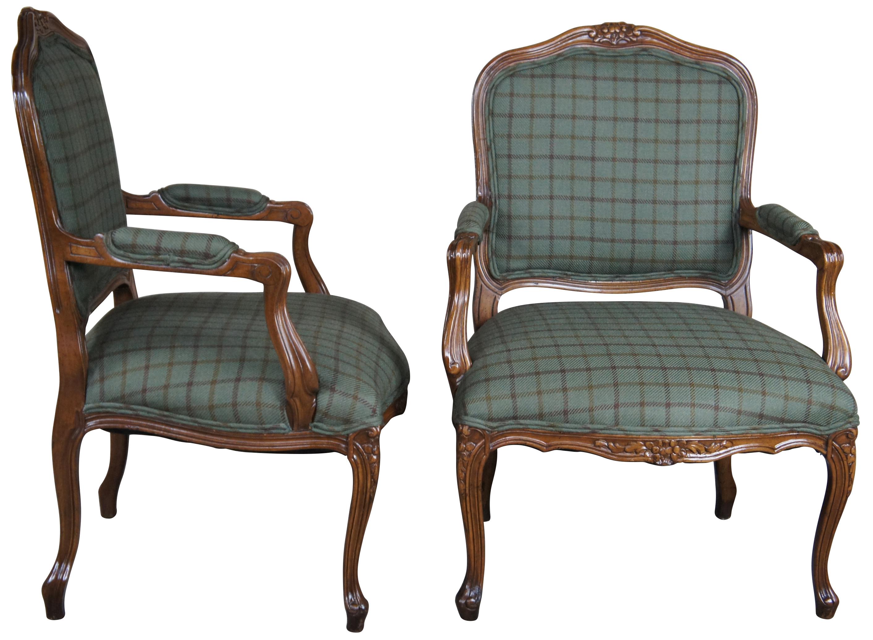 Pair of Meyer Gunther & Martini French Fauteuil arms chairs, circa 1980s. Finished in walnut with serpentine crest and aprons feauturing foliage carving. The chairs are supported by elegant cabriole legs. Upholstered in a Ralph Lauren green plaid