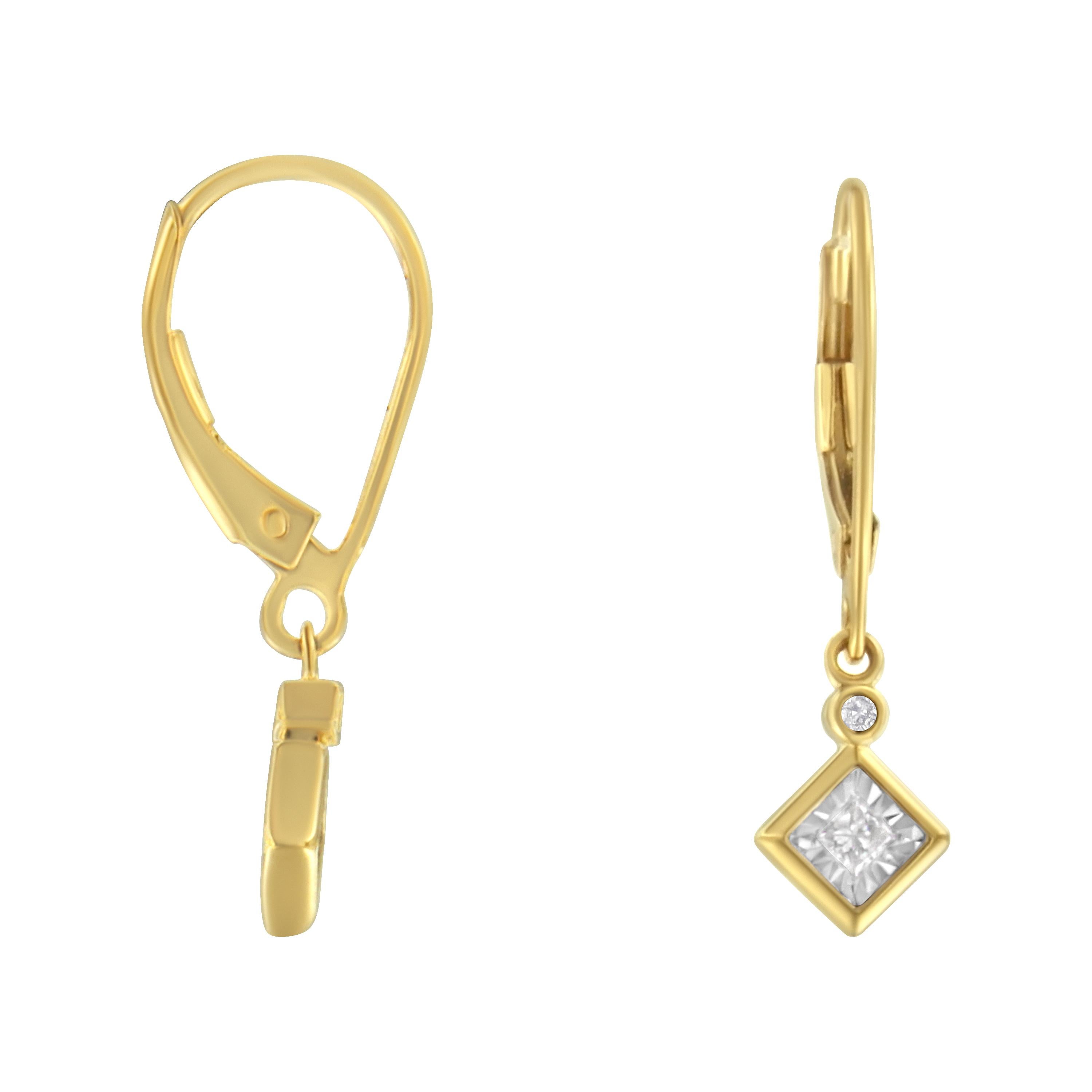 These lovely 14k yellow gold plated sterling silver dangle earrings feature 1/3ct of diamonds. A bezel set round diamond sits on top of a miracle set princess cut diamond. The small diamond design dangles from a lever back hook and adds the perfect
