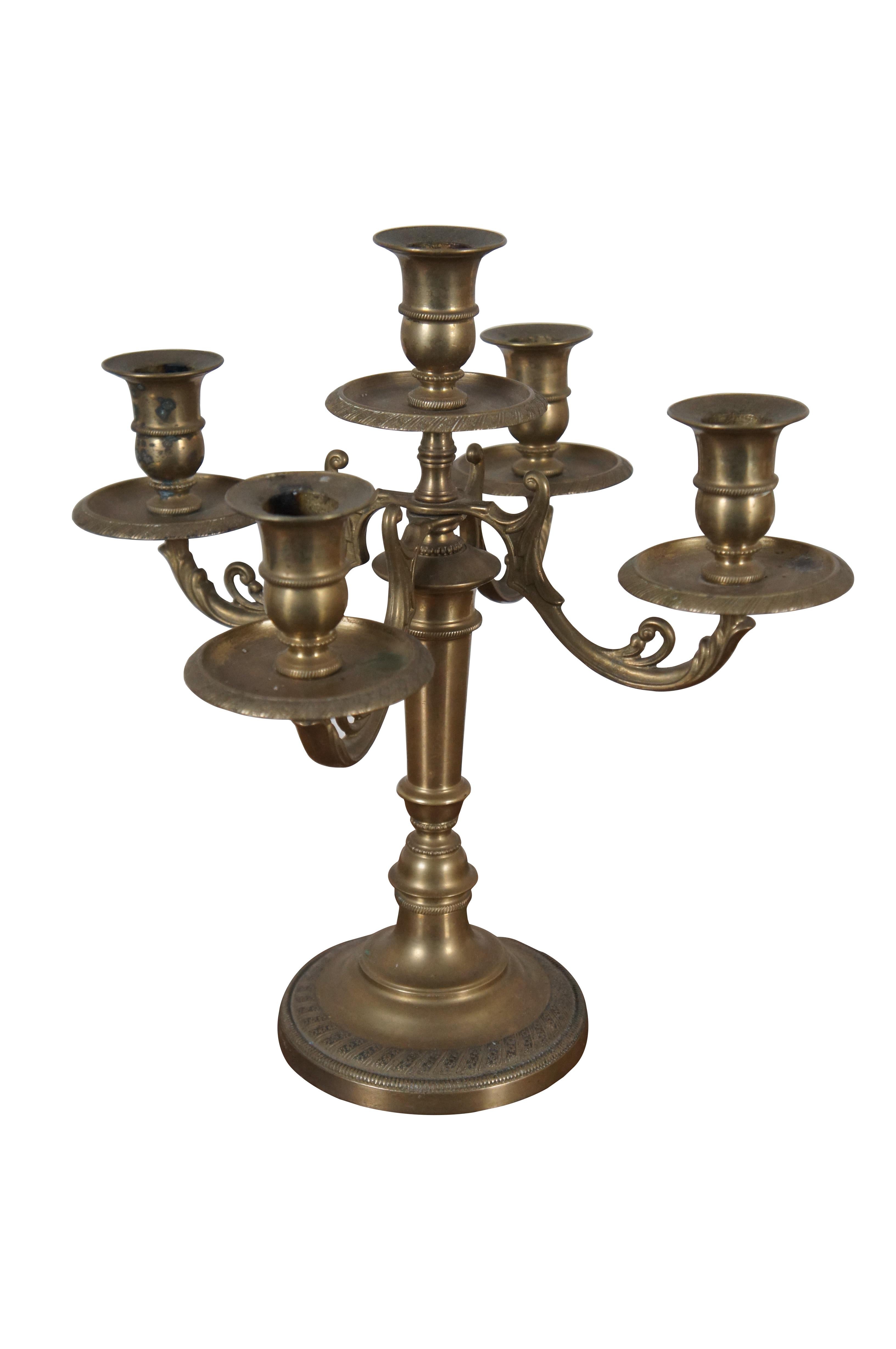 Two mid 20th century Art Nouveau style brass candlesticks featuring five lights with a floral acanthus motif.

Dimensions:
11