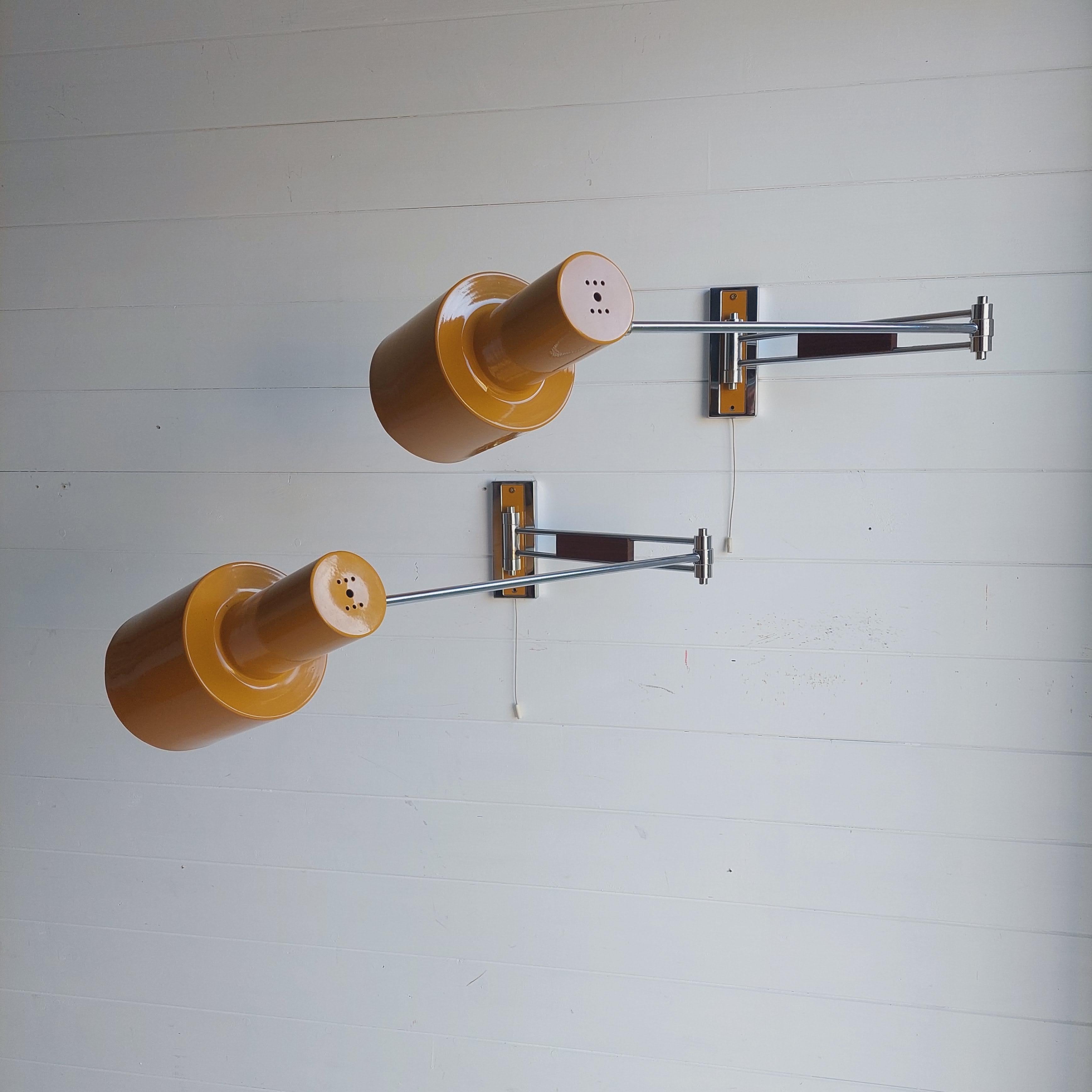 Mid Century Modern wall lamp, Set of 2
A rare swing arm wall sconces  in its original mustard color.
Probably designed by Jo Hammerborg and manufactured by Fog & Mørup in Denmark from 1969-75, although we haven't found any other model exactly as