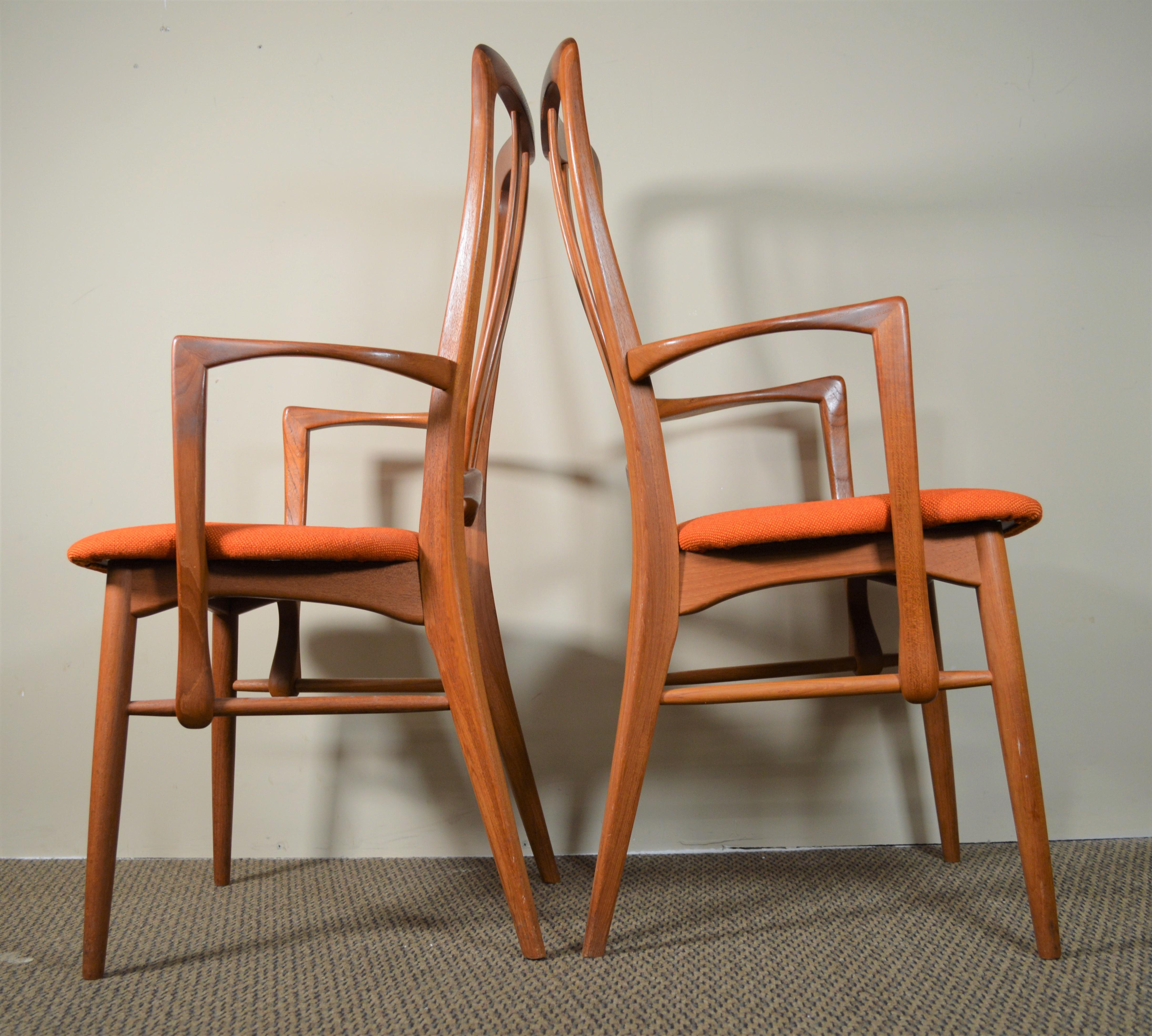 This is a pair of Danish teak dining chairs with arms. Called Ingrid chairs designed in the 1960s by Niels Koefoeds. Made in Denmark. New orange wool upholstery.

Very good condition. The chairs have been reupholstered. The teak frames are in very