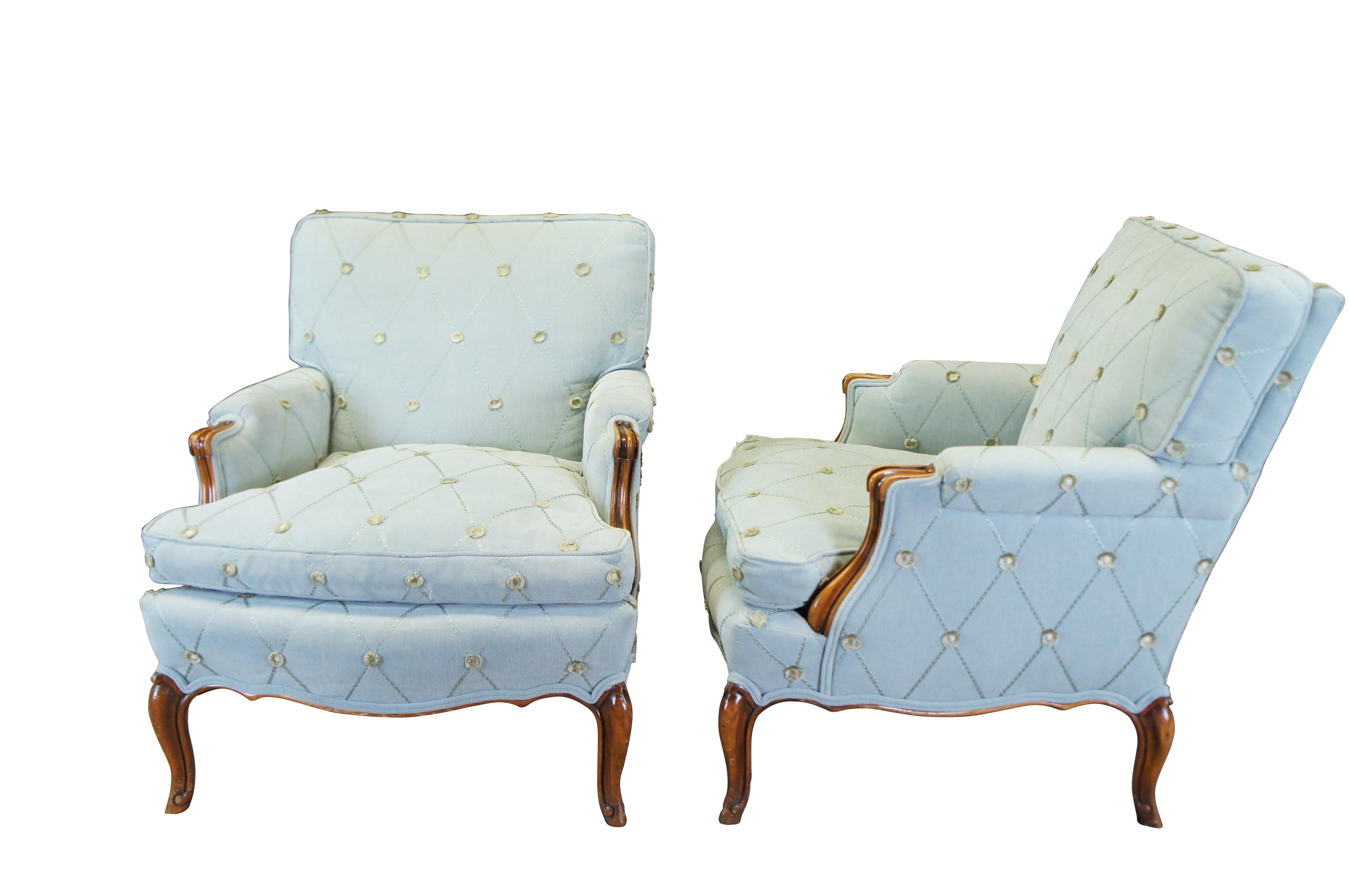 Pair of two Mid Century French Provincial club lounge library arm chairs.  Made of walnut featuring serpentine form with petite rolled arms, geometric diamond design upholstery and down filled seats.

DIMENSIONS

29