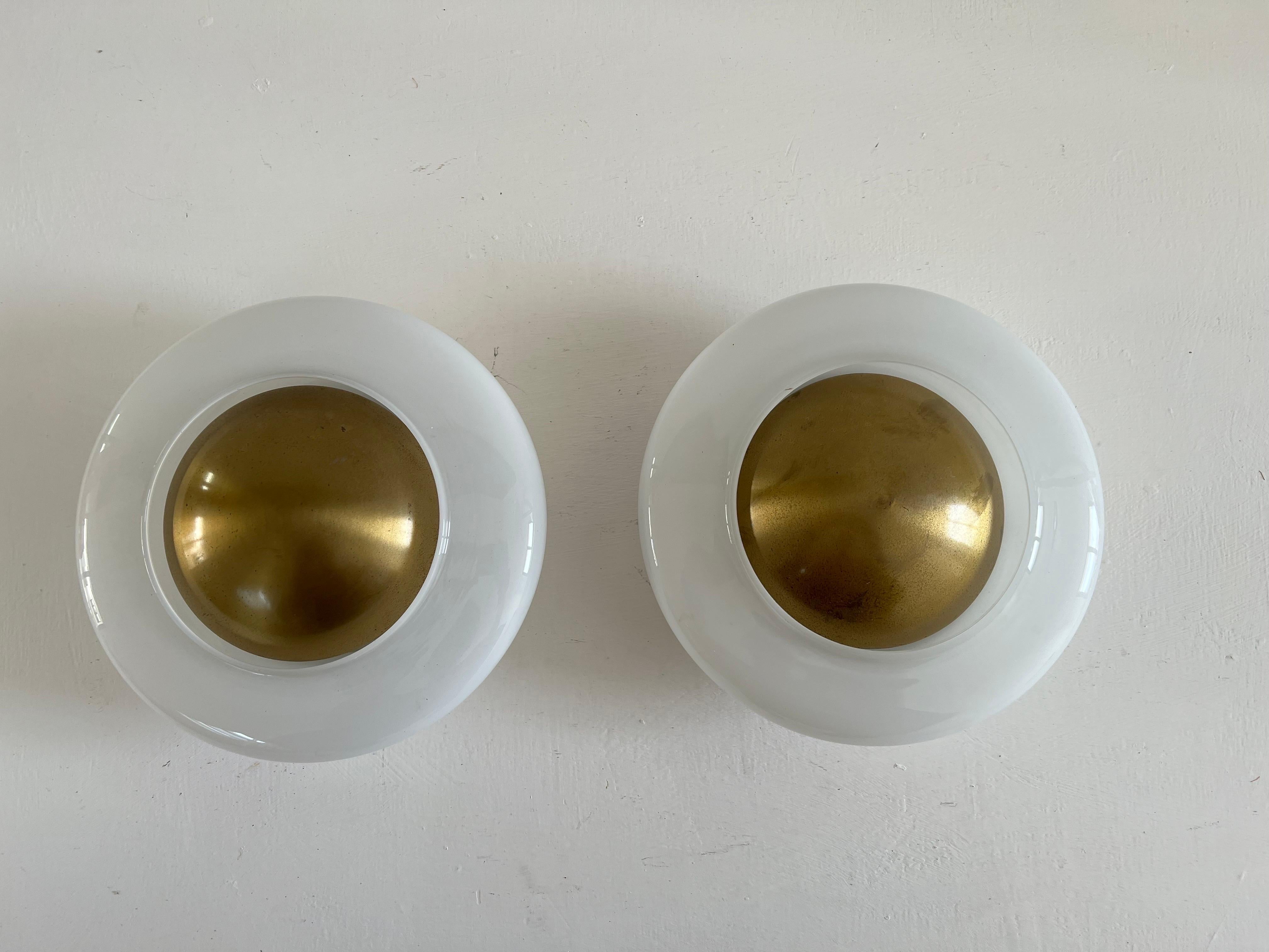 4 Mid-Century Modern Flush Mounts or sconces by Valenti made in Italy circa 1960 and produced in blown glass and brass.
Both still retain their papel labels.
Each holds two e14 bulbs. 
Priced individually.