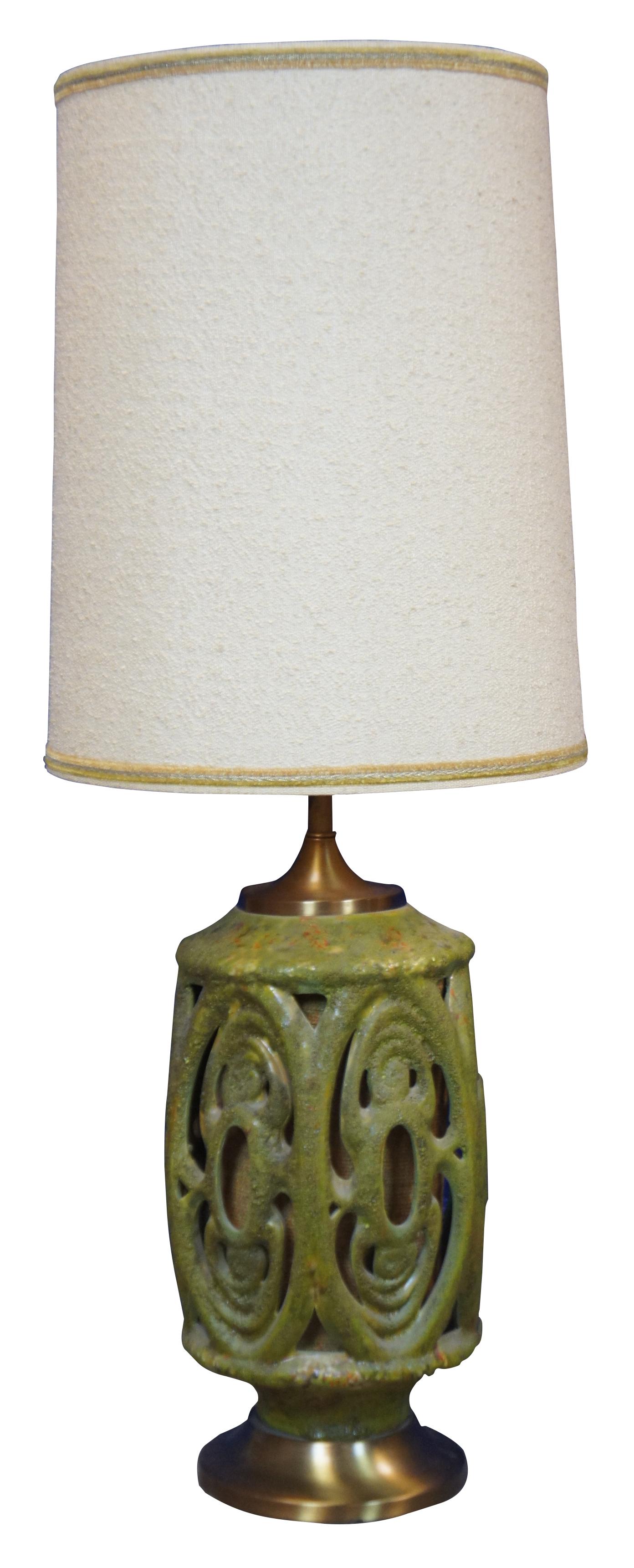 Two 1960s mid century modern cut out / reticulated ceramic table lamps in green and orange lava glaze over a matching burlap core with large barrel shades. Marked Wescal on the harps.

Measures: 9.5” x 24” / Shade - 16” x 20” (Diameter x Height).