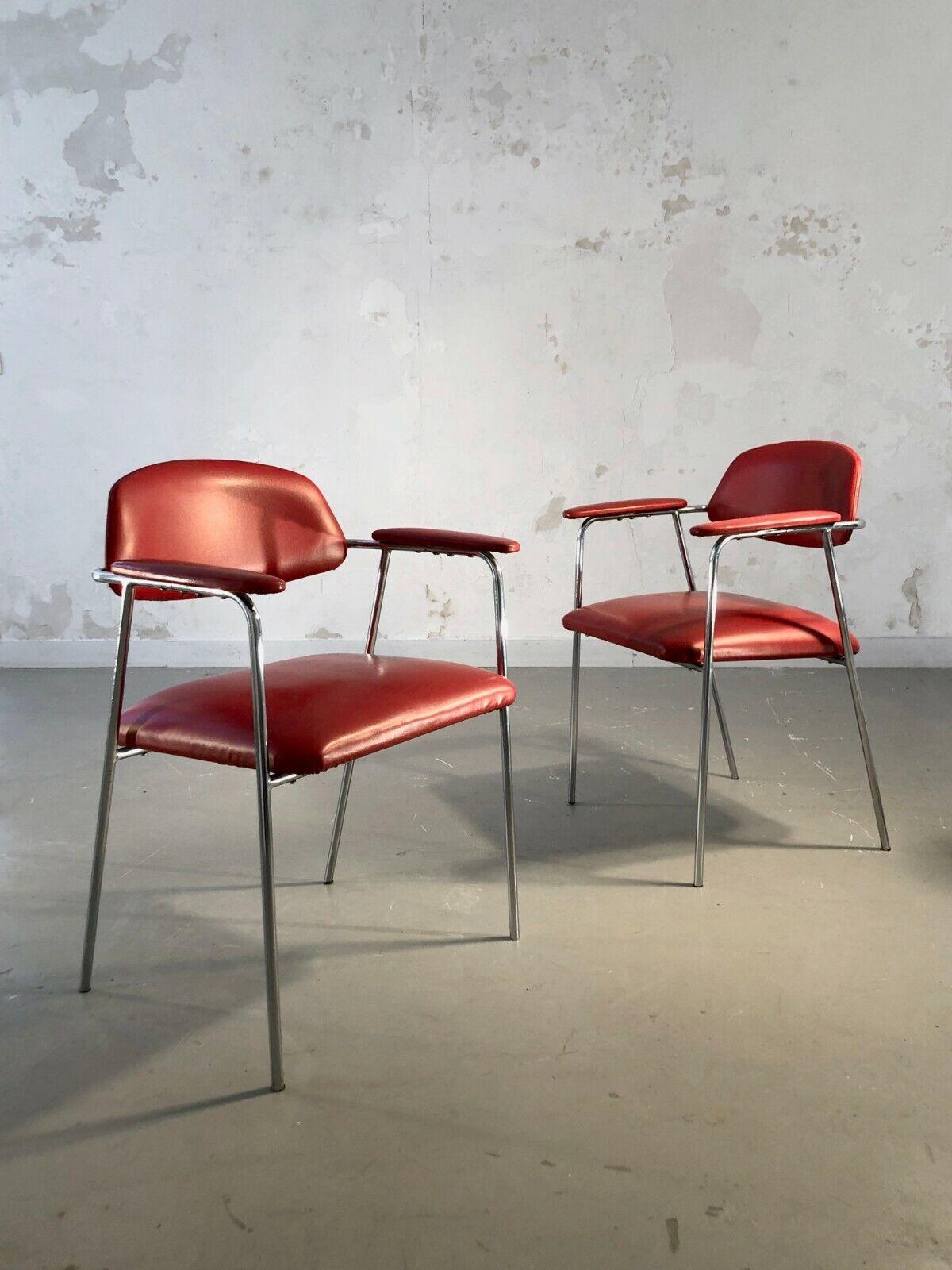 A pair of chairs with armrests, Modernist, Free Form, chromed tubular metal structures, comfortable seats and armrests in superb red imitation leather, attributed to Pierre Paulin, Steiner edition, France 1950-1960. Steiner labels under each