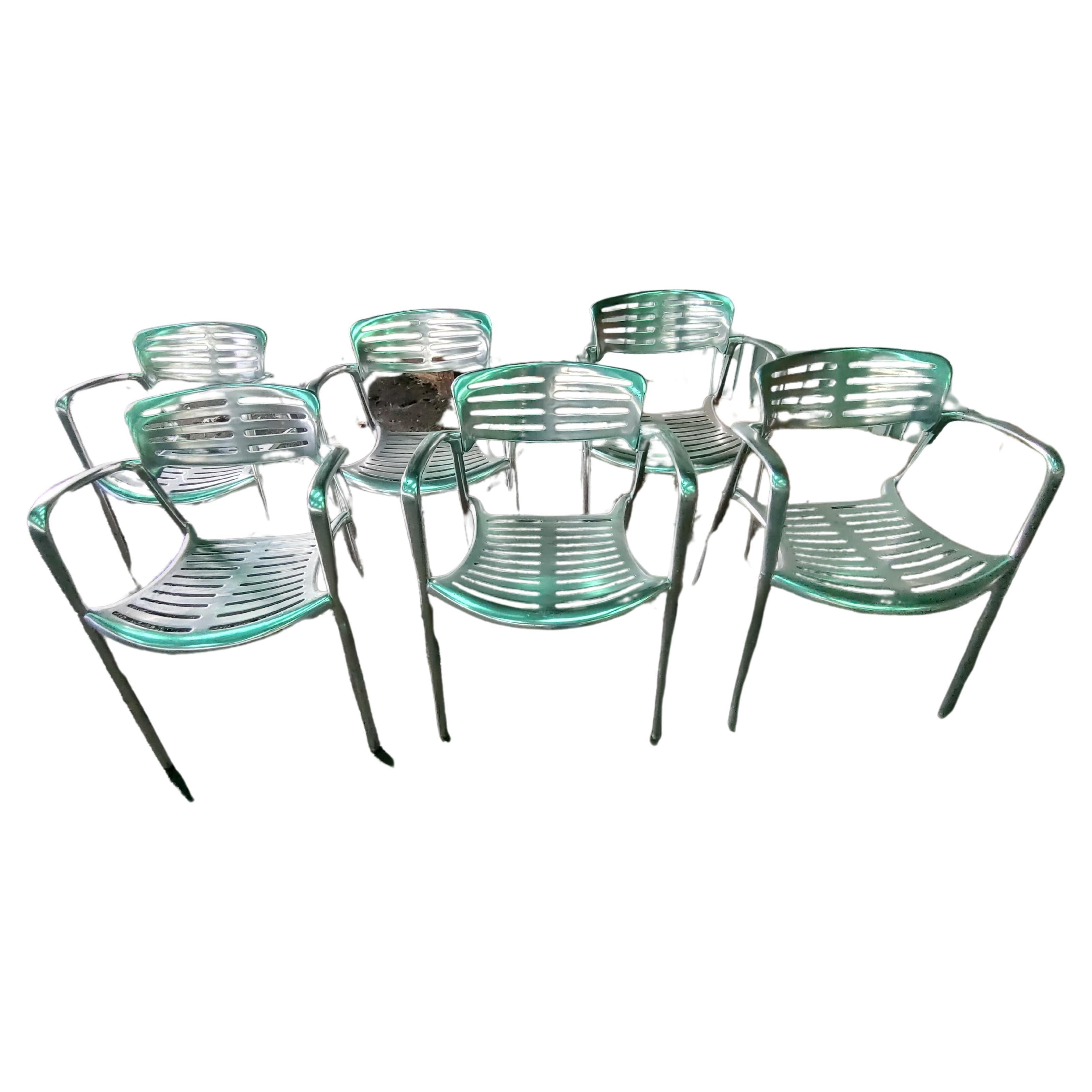 Fabulous simple yet elegant design by Jorge Pensi for Amat. Top quality cast aluminum elements which are fitted to each other. In excellent vintage condition with minimal wear. Scratches to finish, nothing deep. Chairs stack and were used in a cafe