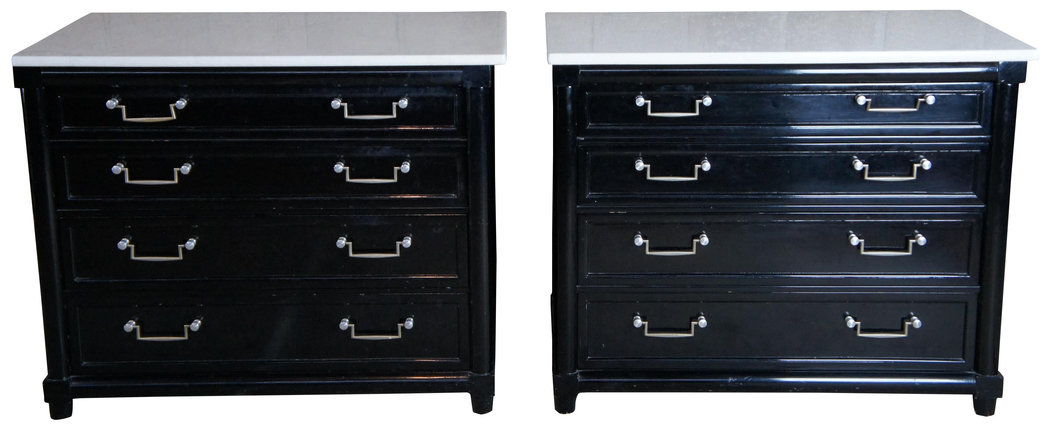 A neat pair of contemporary chests. Finished in black with 4 oak dovetailed drawers and a white marble top. Features fluted sides and silvertone bail style drawer pulls. 
 