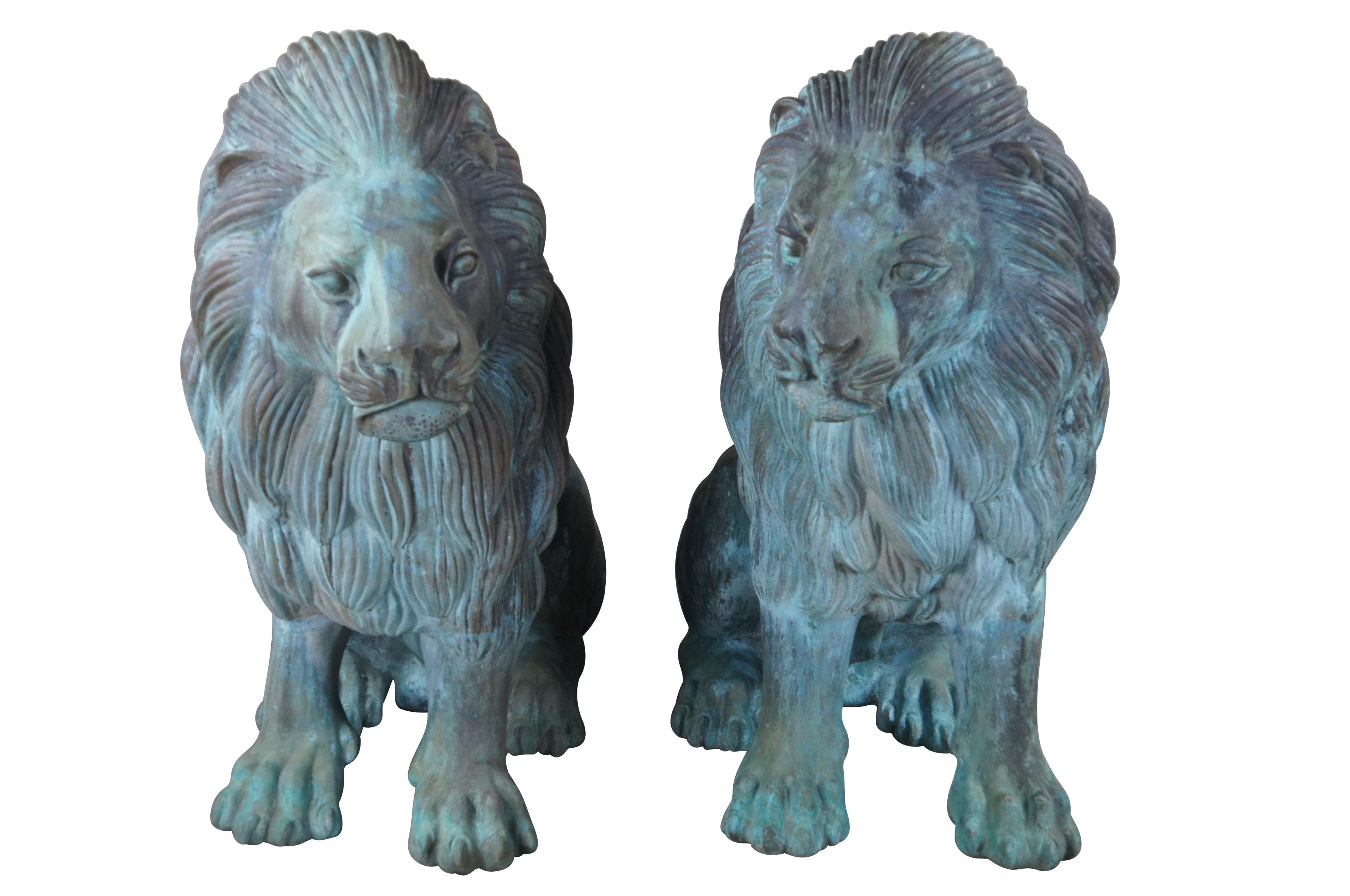 Two large and impressive entry gate lion statues.  This beautiful pair of left and right facing lions are made of cast bronze featuring heavy verdigris patina.  Their life like patina makes for a grand addition to any setting.  Suitable for Indoor
