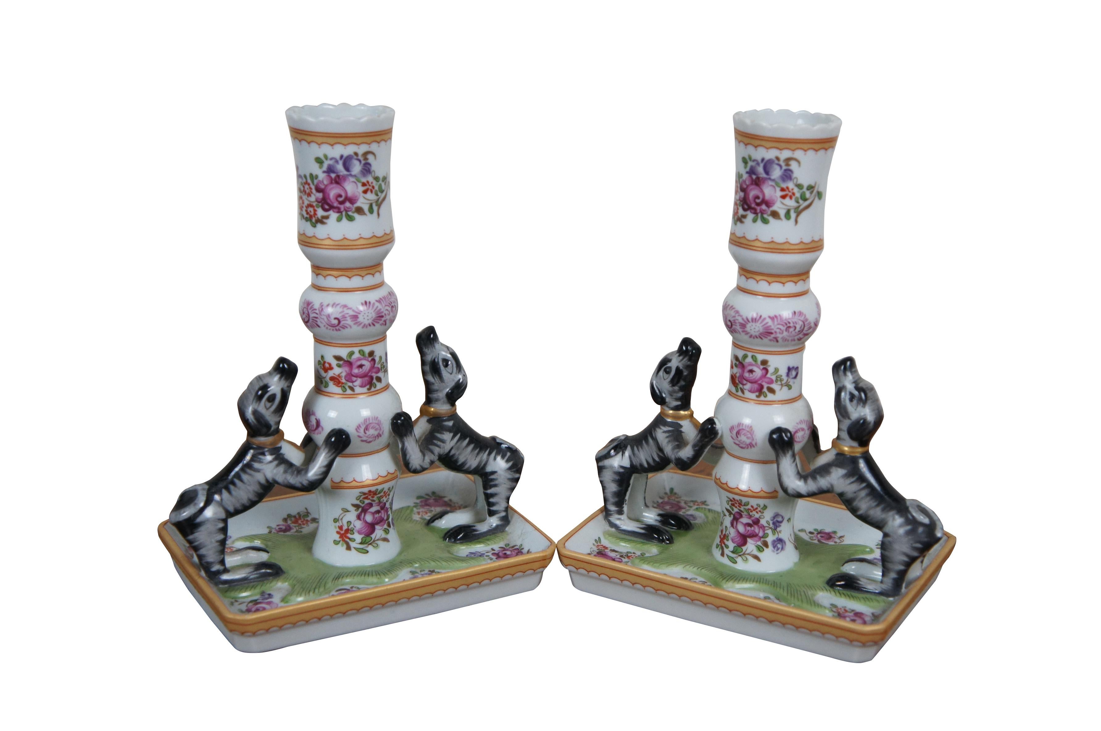Pair of late 20th century pair of porcelain candlesticks by Mottahedeh from the Stately Homes - Sir Humphrey (Humphry) Wakefield series. Rectangular base with turned single taper holder decorated with famille rose style floral motif and gold