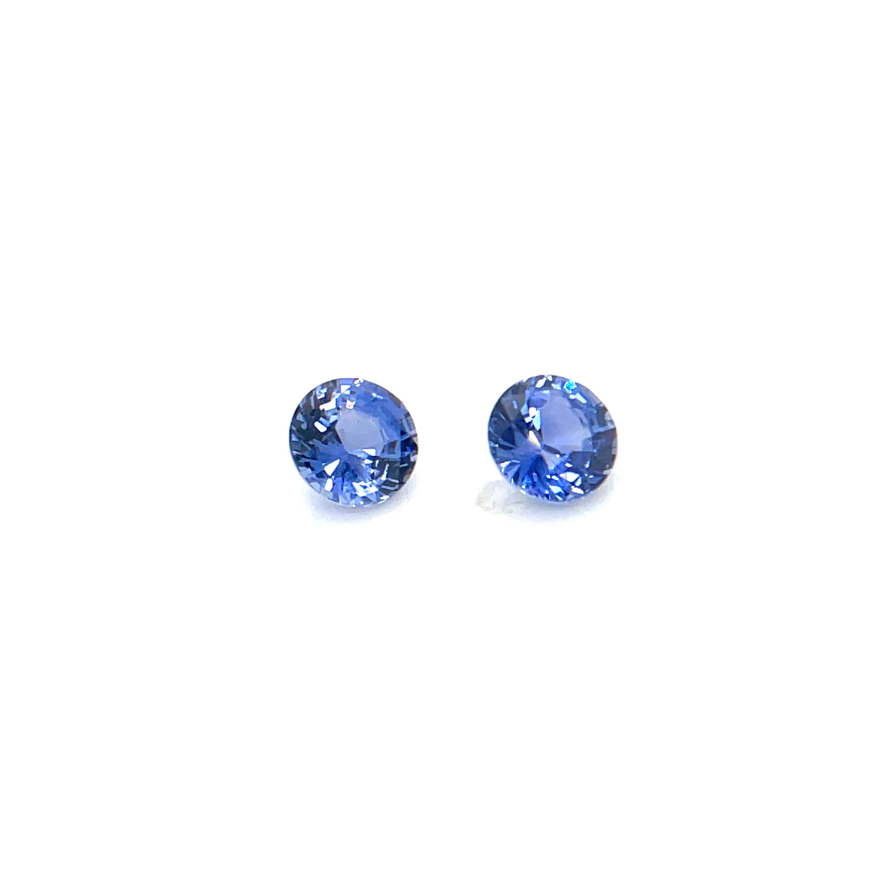 Contemporary 2 Natural Round Diamond-Cut Blue Sapphires Cts 1.21 For Sale
