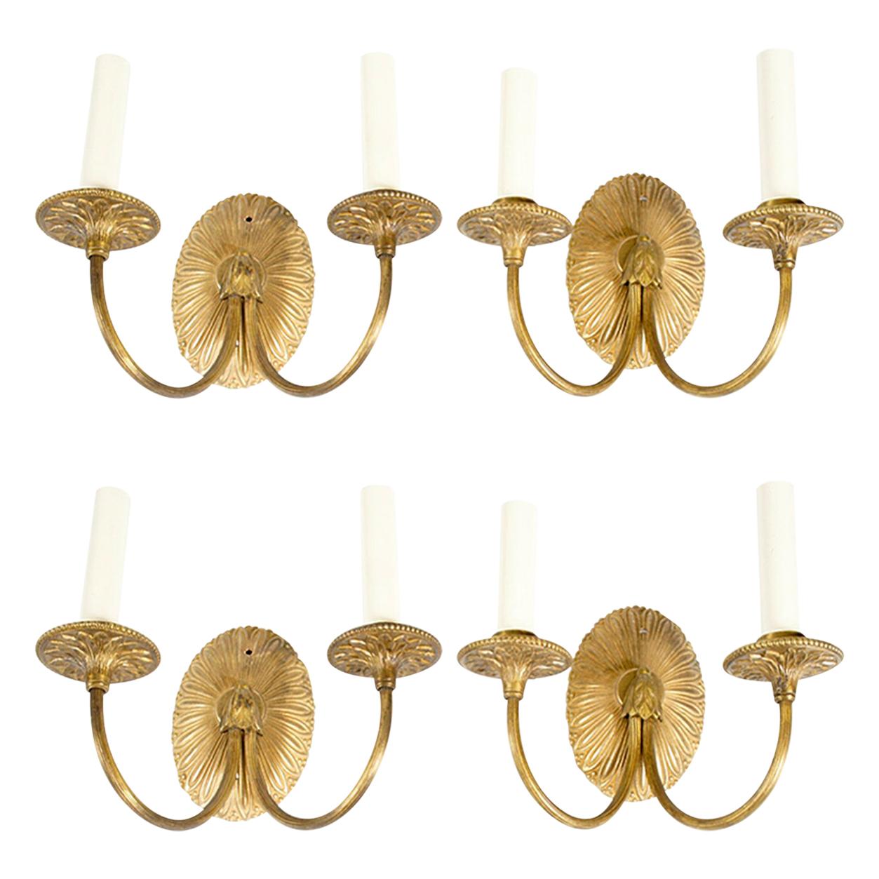 Four Neoclassical Gilt-Metal Sconces