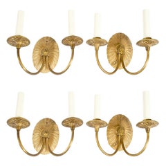 Four Neoclassical Gilt-Metal Sconces